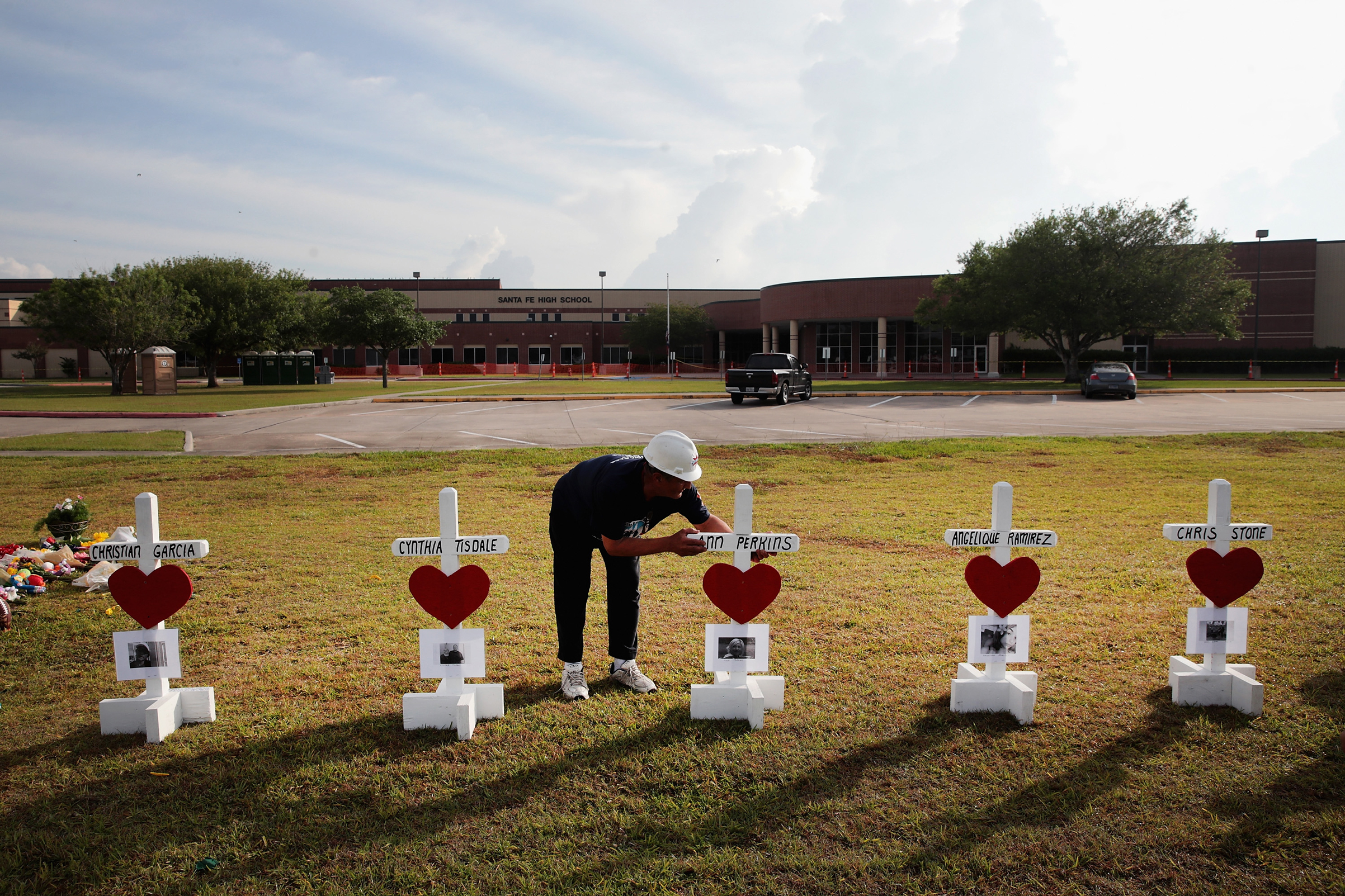 Greg Zanis lines up crosses he built in front of Santa Fe High School on May 21, 2018 in Santa Fe, Texas. (Scott Olson/Getty Images)