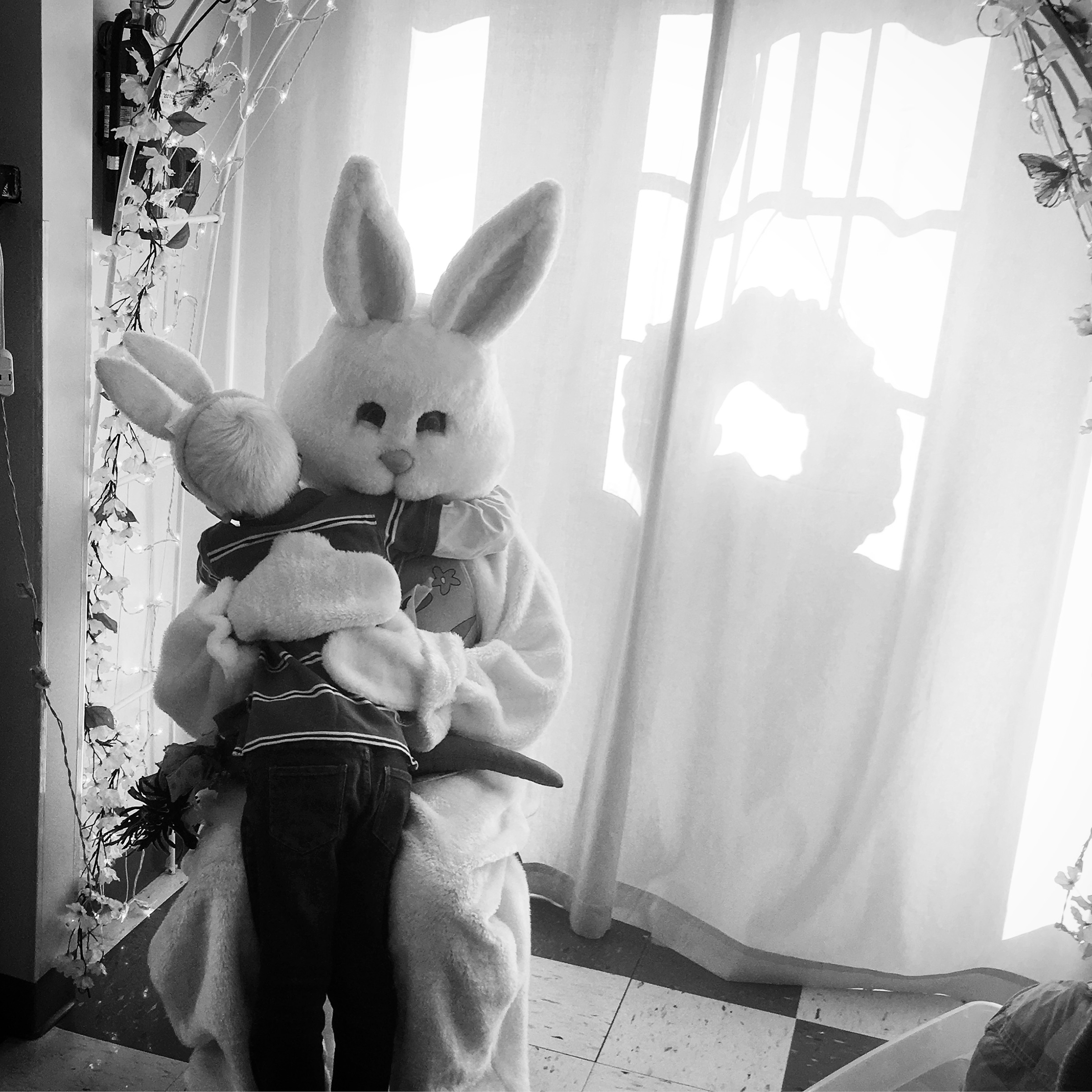 Forest rushes to the front of the line at his sister's preschool to give a hug to the Easter Bunny. (Bryan Hoben)