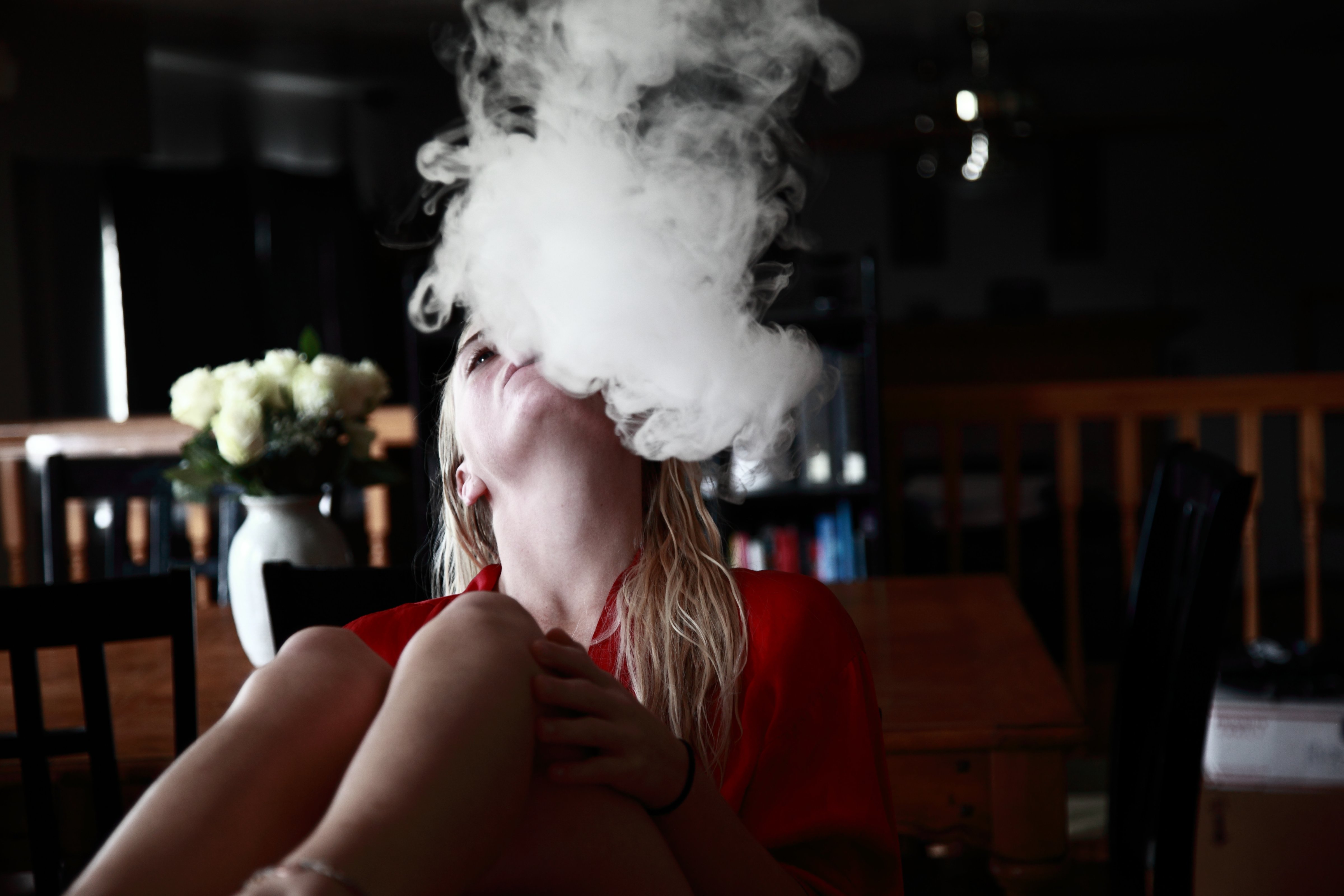 Young Woman Exhaling Smoke