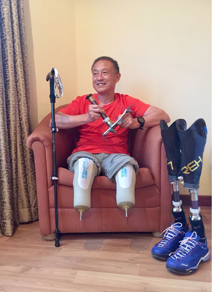 Xia Boyu, a 69 year-old double amputee from China, sitting in his hotel room in Kathmandu prior to his fifth attempt to summit Mount Everest, on April 4, 2018. (Casey Quackenbush—TIME)