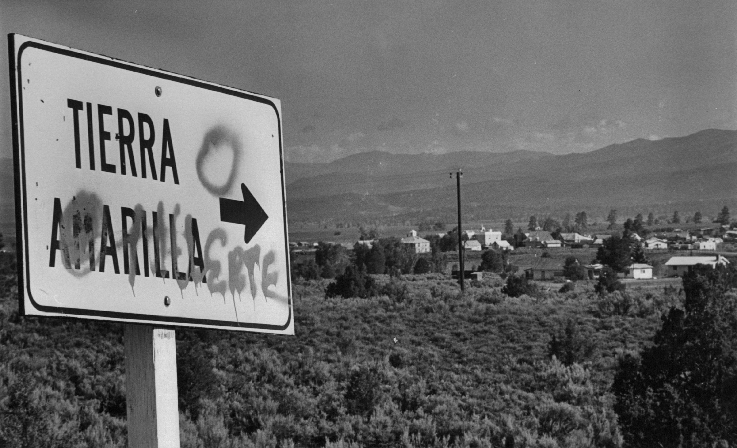 The road sign marking Tierra Amarilla, N.M., has been changed to read Tierra O Muerte, land or death, in the continuing land grant struggle. 1976. (Denver Post/Getty Images)