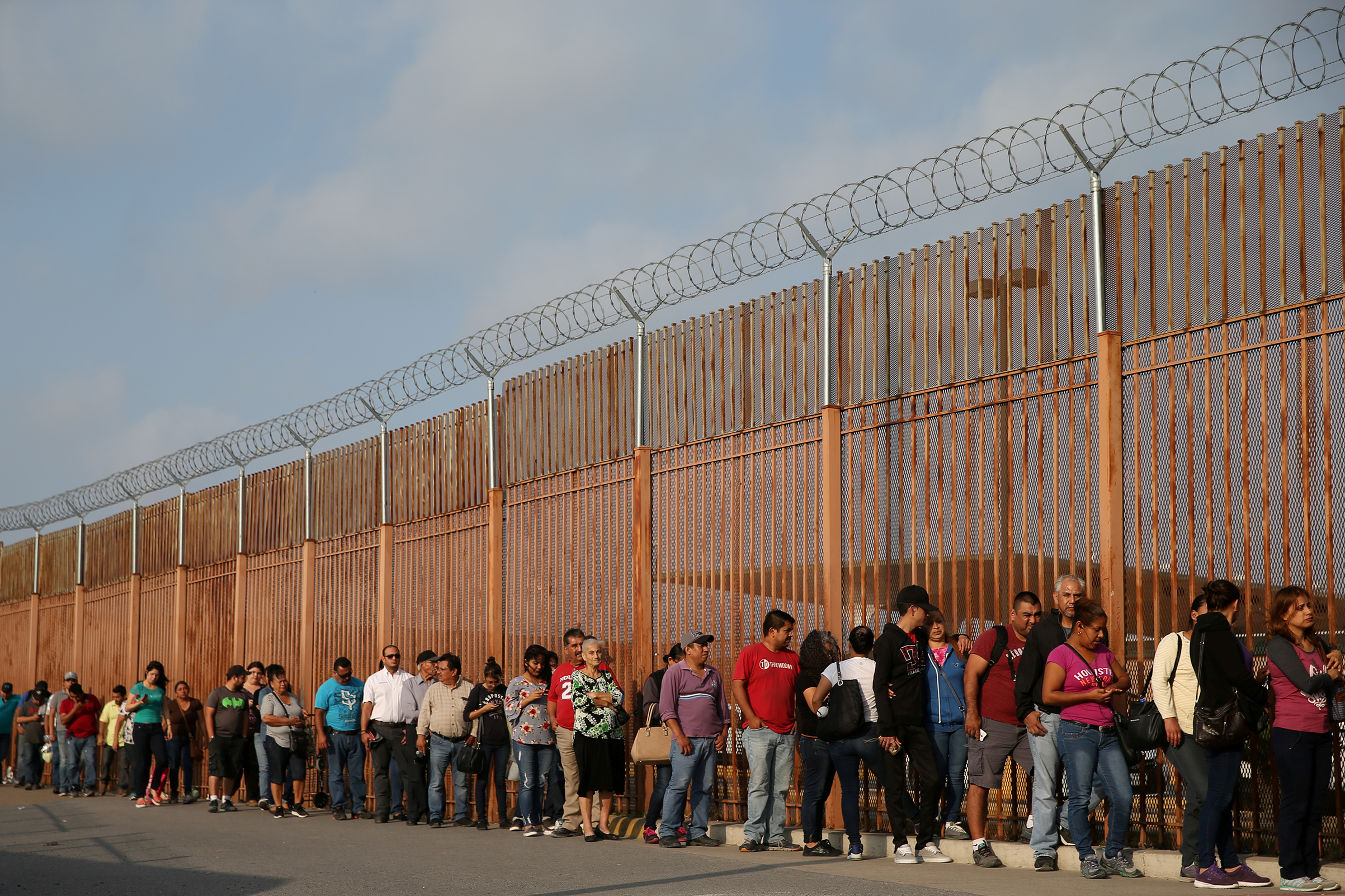 Pedestrian travelers wait in a U.S. Customs and Border Protection line at the Mexico-U.S. border port of entry in Hidalgo, Texas, U.S., April 13, 2018. (Loren Elliott —REUTERS)