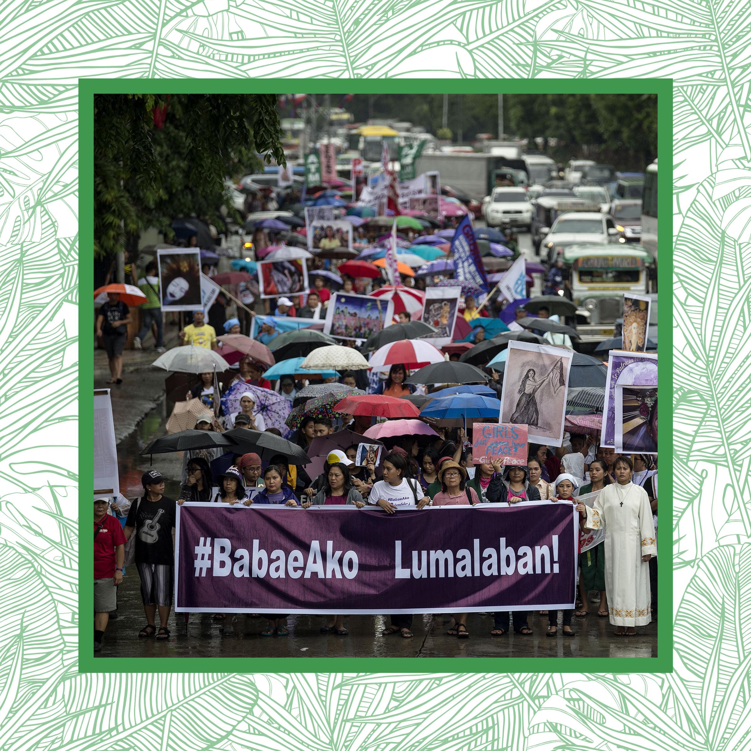 Female protesters march on the streets of Manila on Independence Day.