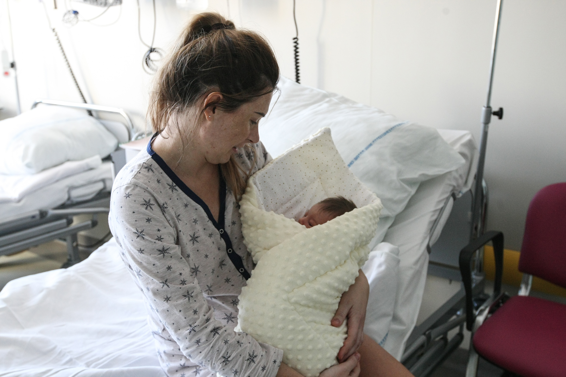 Polish demographers say, that due the child benefit  launched in 2016 by the ruling conservative Law and Justice party (PiS) number of births is expected to rise, but the trend will not offset the overall fall in the population in the long term. Agnieszka Gessela and her newborn daughter Helena are seen in maternity hospital delivery room  in Gdansk, Poland on December 20, 2017 (Michal Fludra—Getty Images)