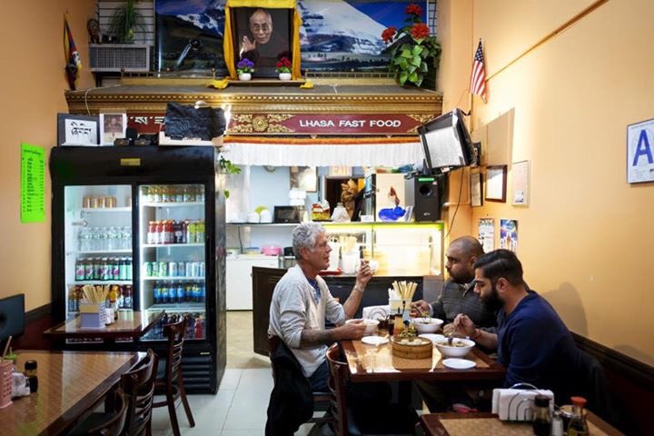 Ali Najmi chats with Anthony Bourdain in Jackson Heights while eating Tibetan food for an episode of his show "Parts Unknown" in the New York City borough of Queens (Courtesy of Ali Najmi)
