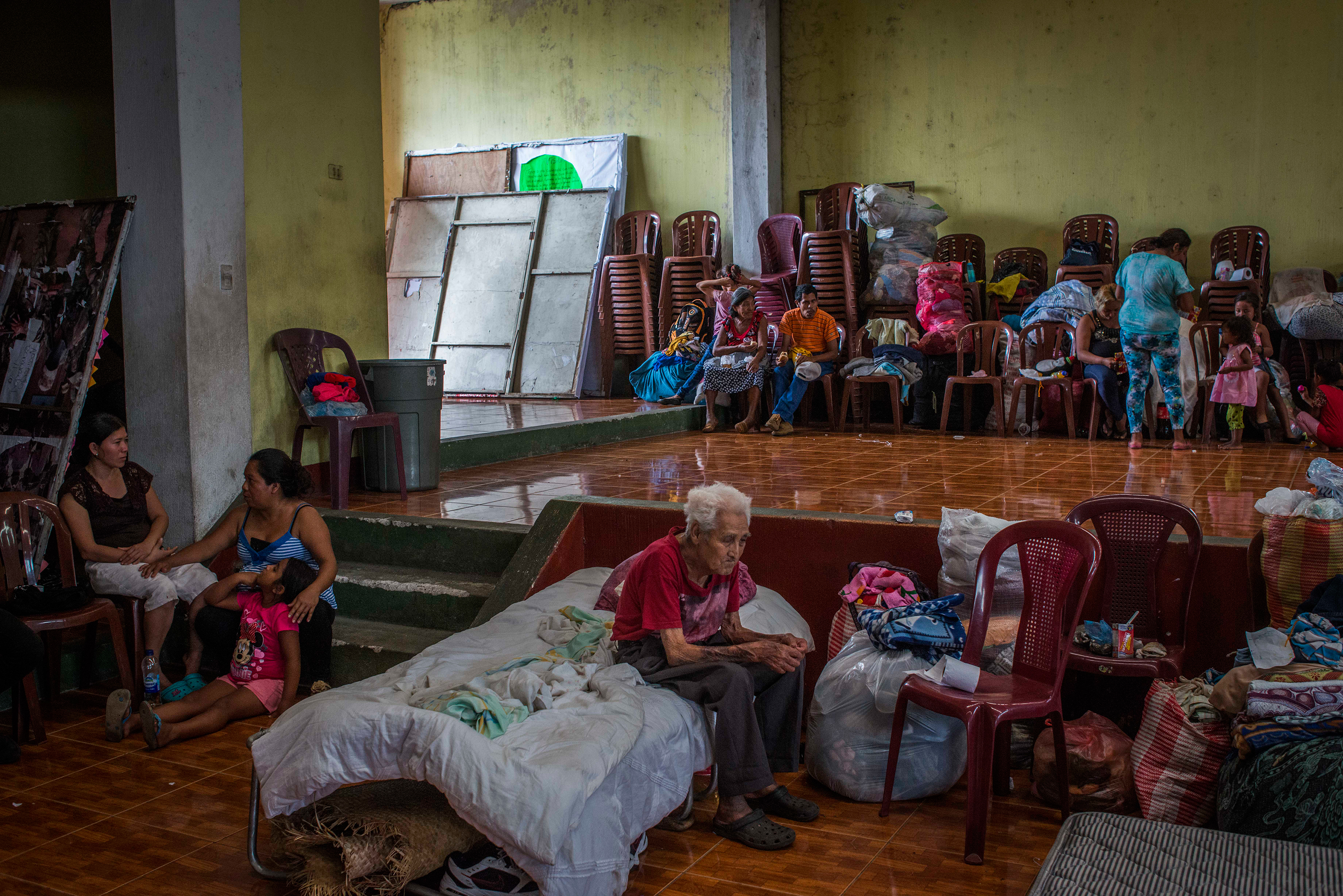 Residents of San Miguel Los Lotes rest in a shelter in Escuintla, a nearby city, on June 4. (Daniele Volpe)