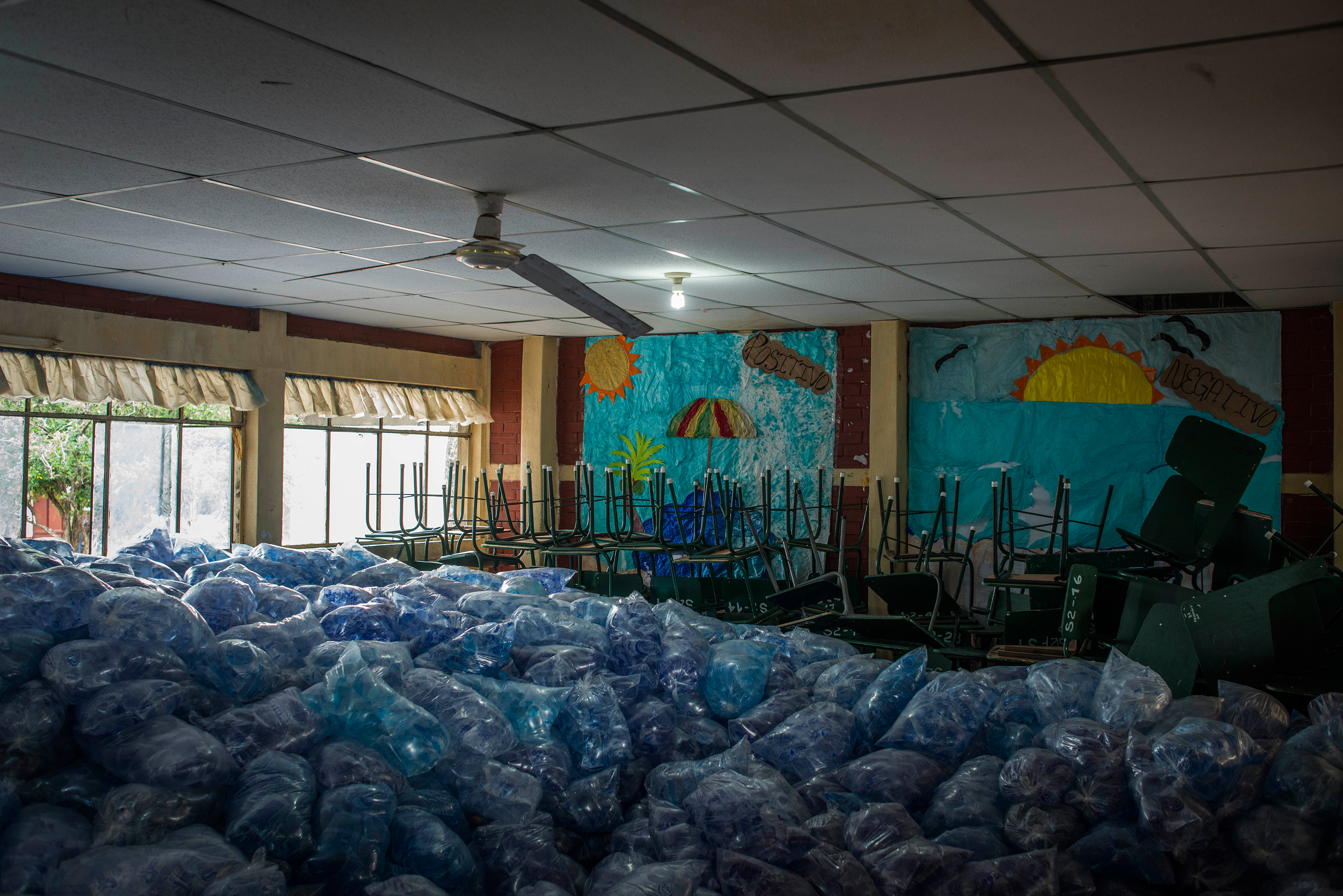 Packages of water fill a room at a shelter in Escuintla on June 4. (Daniele Volpe)