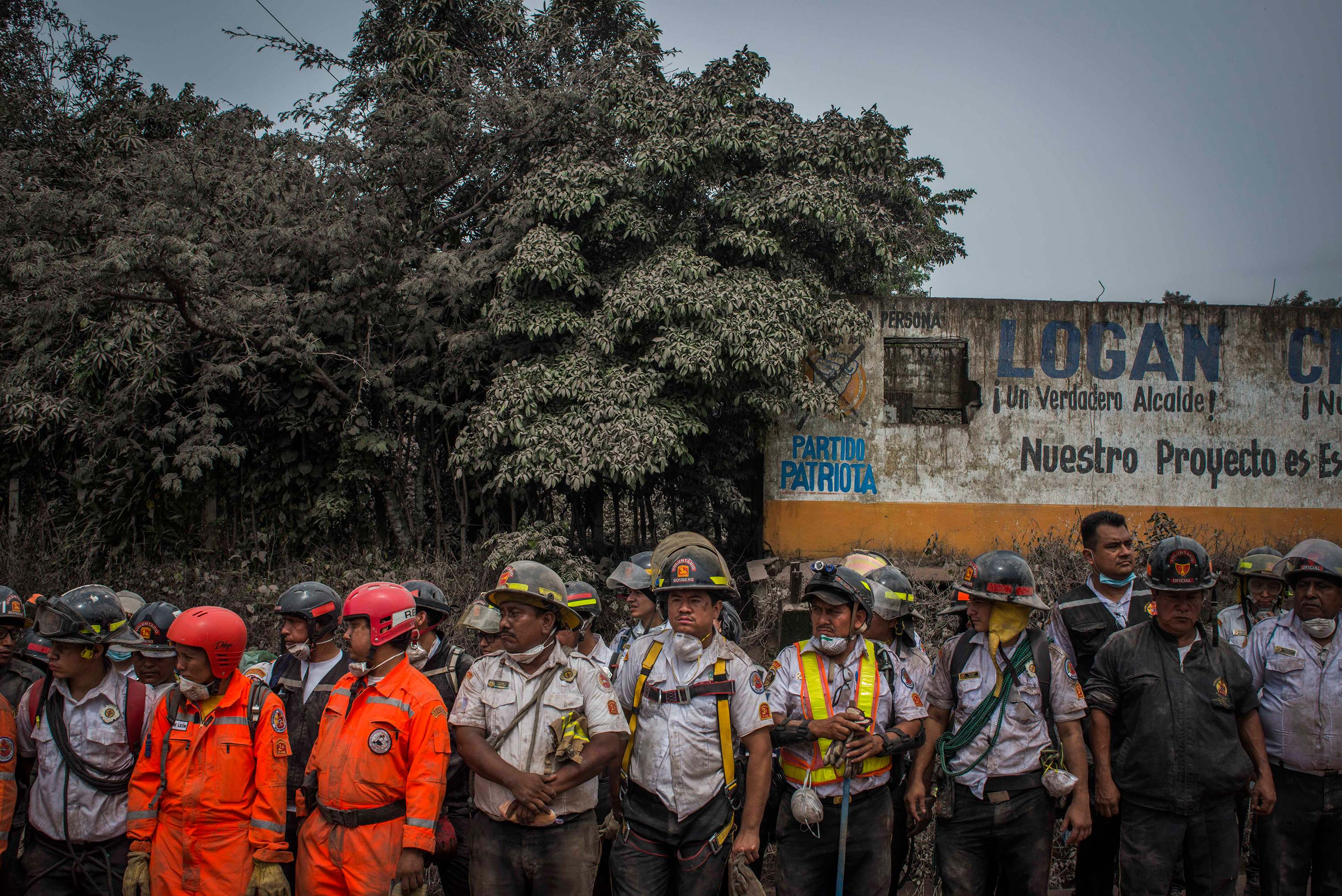 Rescue workers in between search missions in San Miguel Los Lotes on June 4. (Daniele Volpe)