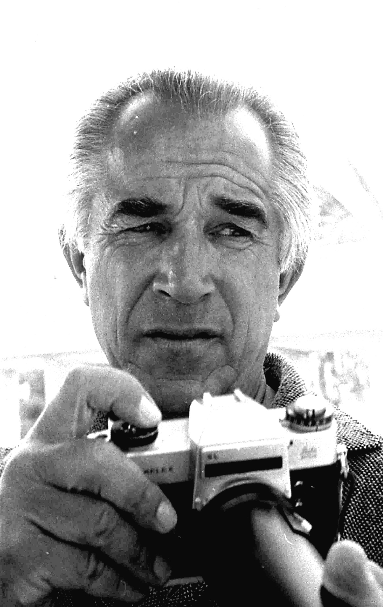 Headshot portrait of American photographer David Douglas Duncan as he holds a camera, Miami, Florida, April 1969. (Ray Fisher—The LIFE Images Collection/Getty)