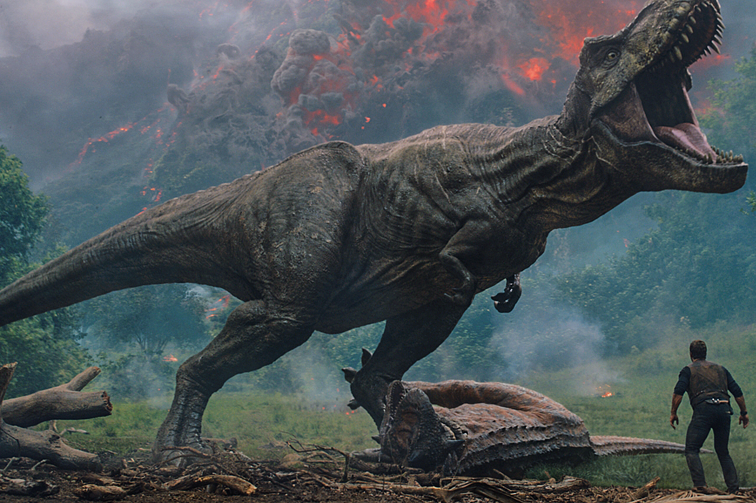 Owen, played by Chris Pratt, meets a vicious T. rex in <i>Jurassic World: Fallen Kingdom</i>. (Photo Credit: Universal Pictures&mdash;COPYRIGHT © 2018 UNIVERSAL STUDIOS and AMBLIN ENTERTAINMENT, INC.
                      and LEGENDARY PICTURES PRODUCTIONS, LLC.)