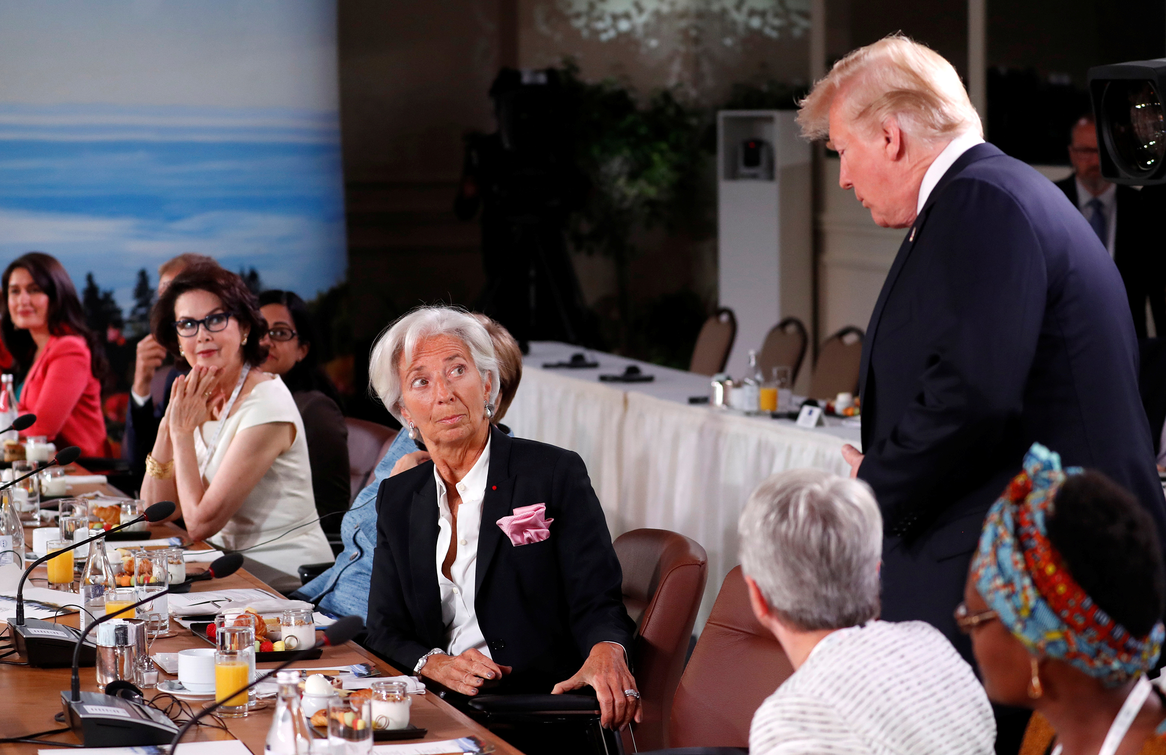 President Trump arrives as Managing Director of the International Monetary Fund, Christine Lagarde, looks up while they attend a G7 and Gender Equality Advisory Council meeting as part of the summit in Canada on June 9, 2018. (Yves Herman—Reuters)