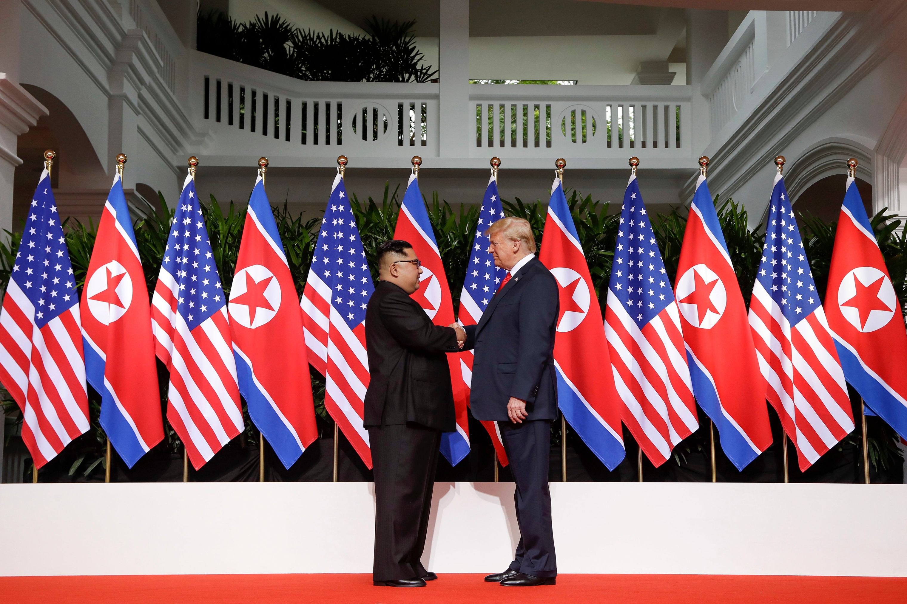 President Trump and North Korea's Kim Jong Un shake hands at their historic summit in Singapore on June 12, 2018. (Evan Vucci—AP/Shutterstock)