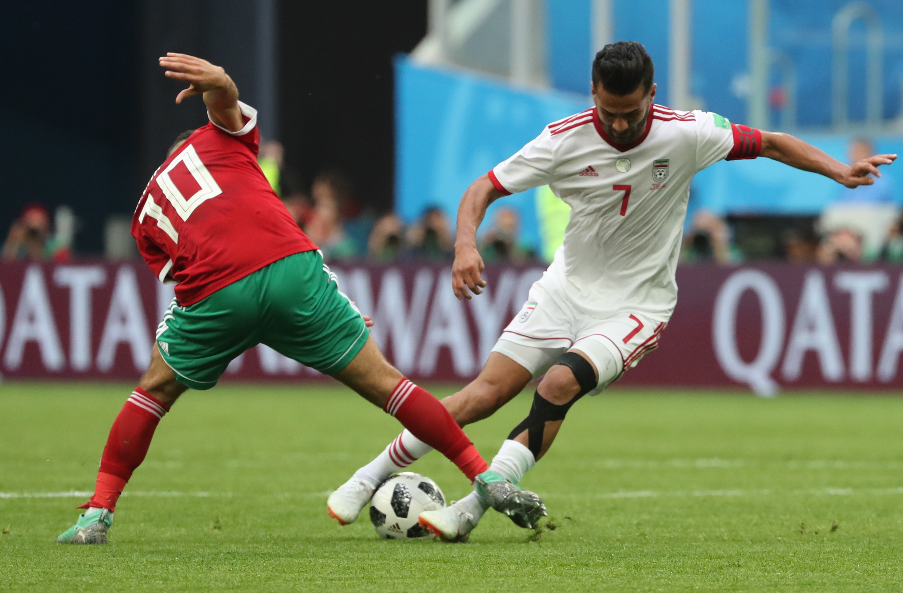 ST PETERSBURG, RUSSIA - JUNE 15, 2018: Morocco's Younes Belhanda (L) and Iran's Masoud Shojaei in a First Stage Group B football match between Morocco and Iran at Saint-Petersburg Stadium (also known as Krestovsky Stadium) at FIFA World Cup Russia 2018 (Alexander Demianchuk&mdash;Alexander Demianchuk/TASS)