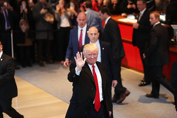 President-elect Donald Trump walks through the lobby of the New York Times following a meeting with editors at the paper on November 22, 2016 in New York City.
