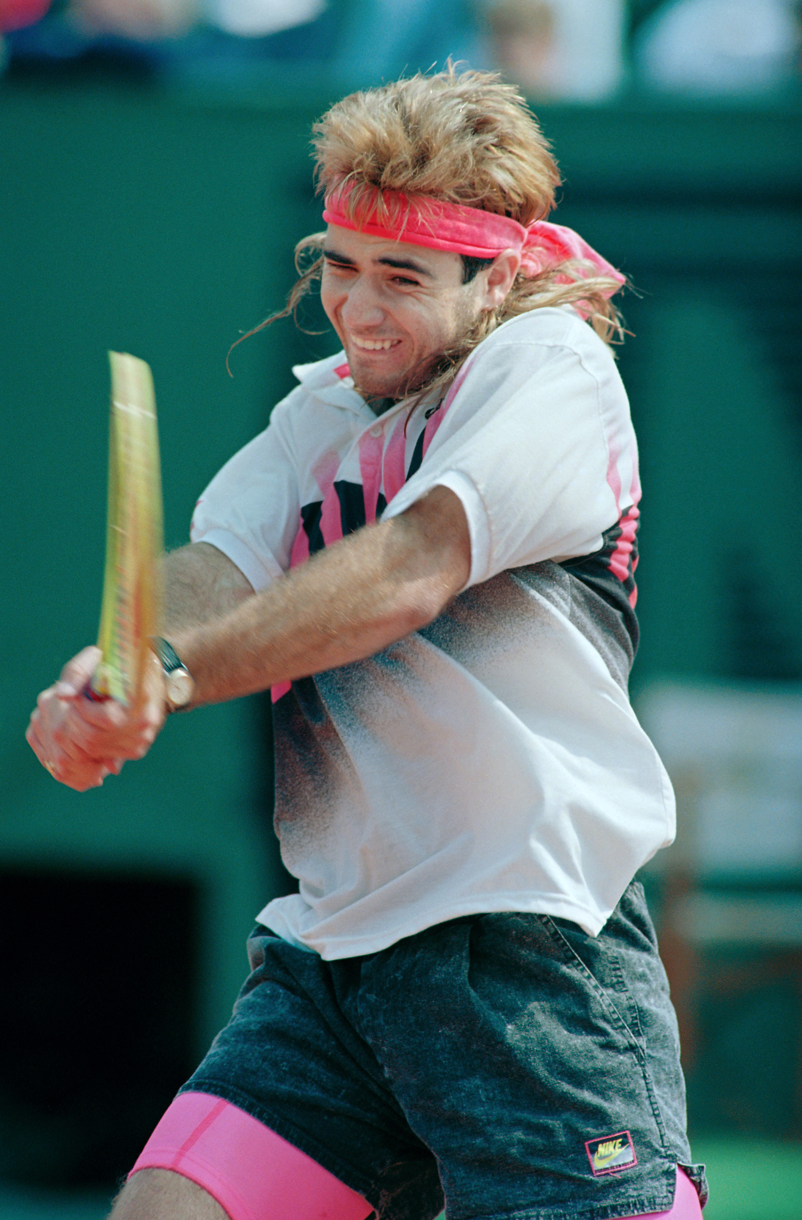 U.S. tennis player Andre Agassi hits the ball in his match against Ecuadorian Andres Gomez during the Men's French Open final on June 10, 1990 at Roland Garros stadium in Paris. (Pierre Verdy—AFP/Getty Images)