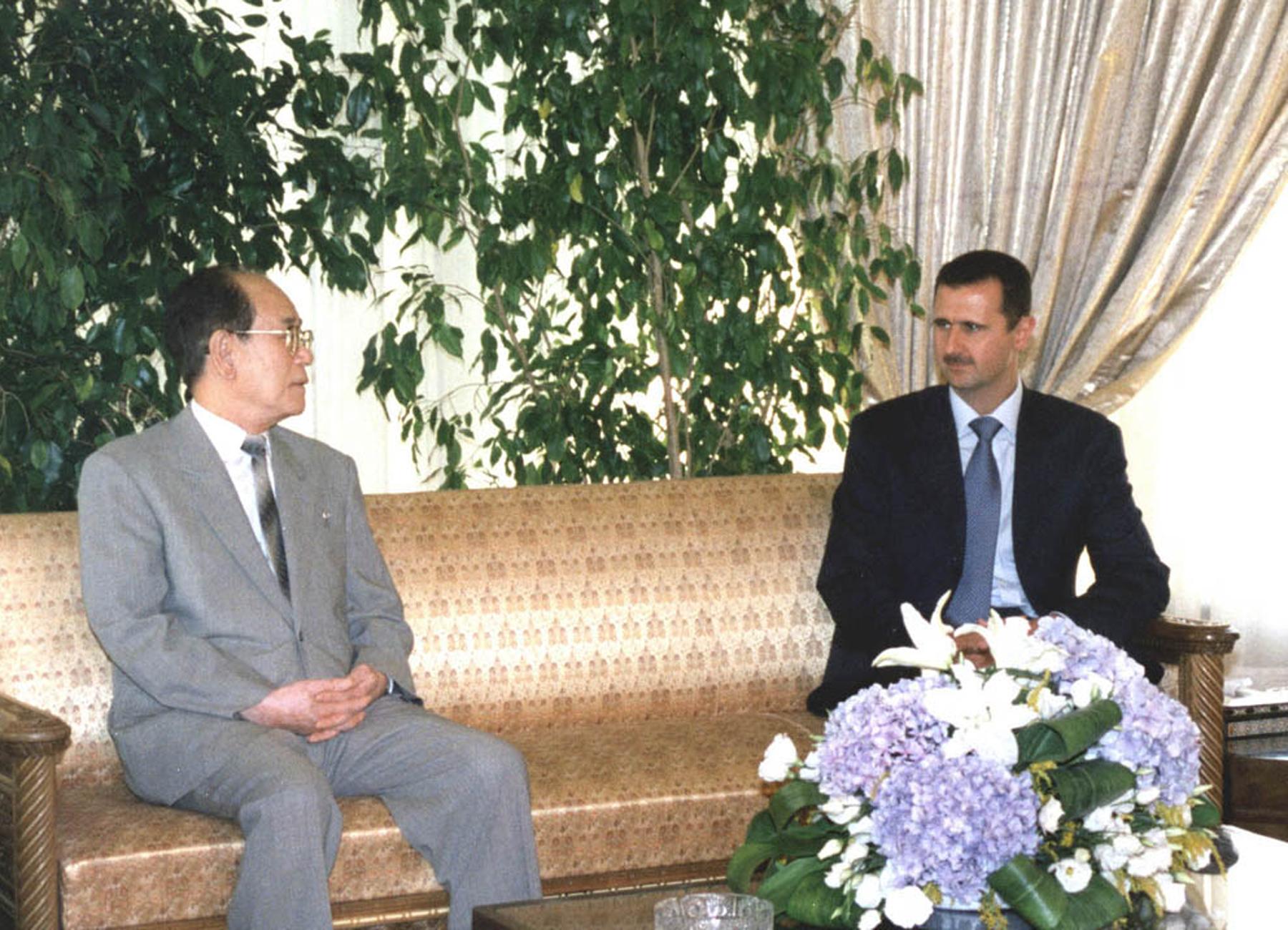 Syrian President Bashar Assad meets with North Korea's second leader, Kim Yong-Nam, in Damascus at the end of the latter's three-day visit to Syria 18 July 2002. (AFP/Getty Images)