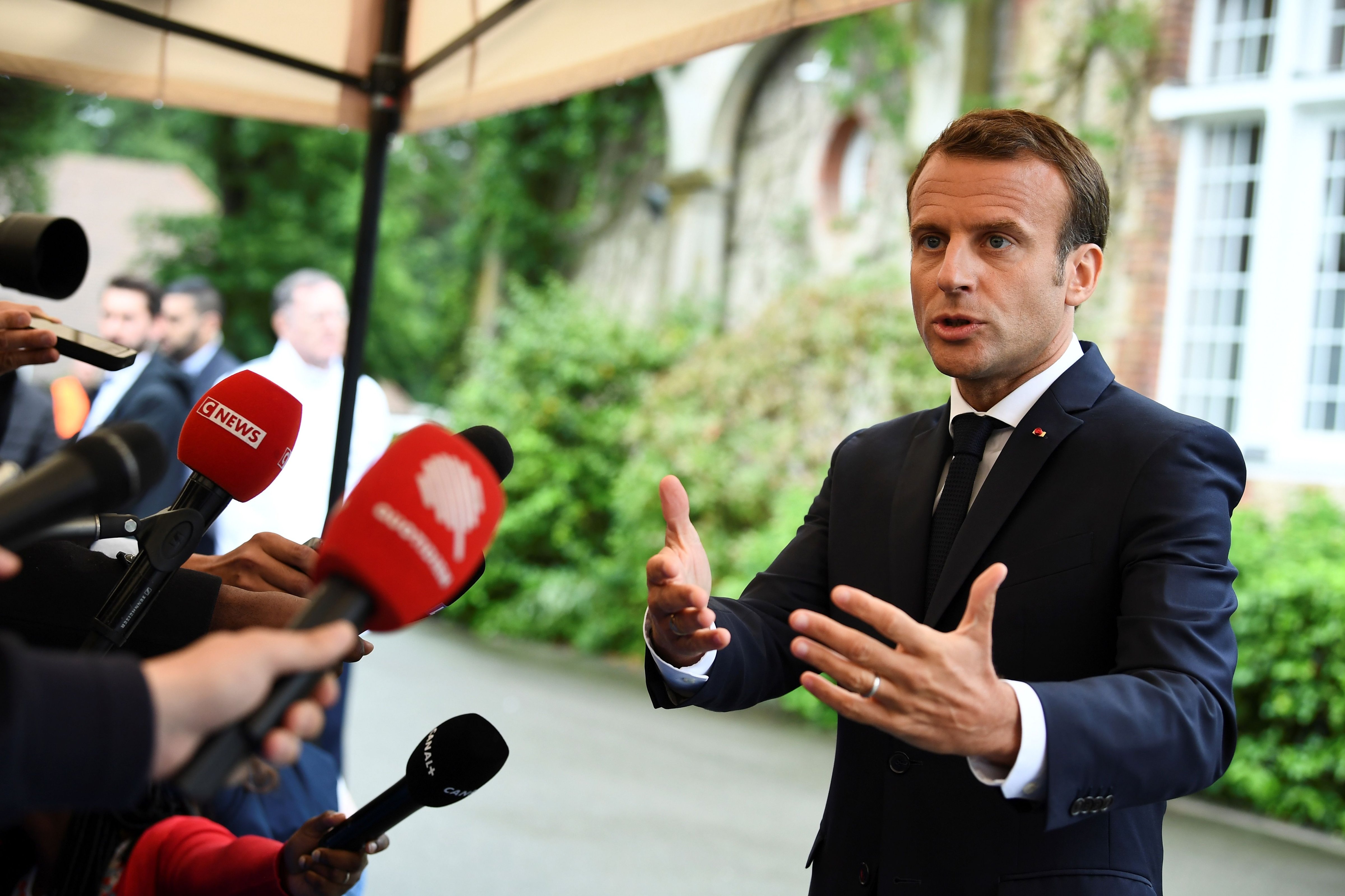 French President Emmanuel Macron speaks to the press during a visit in Clairefontaine-en-Yvelines on June 5, 2018. (Franck Fife – AFP/Getty Images)