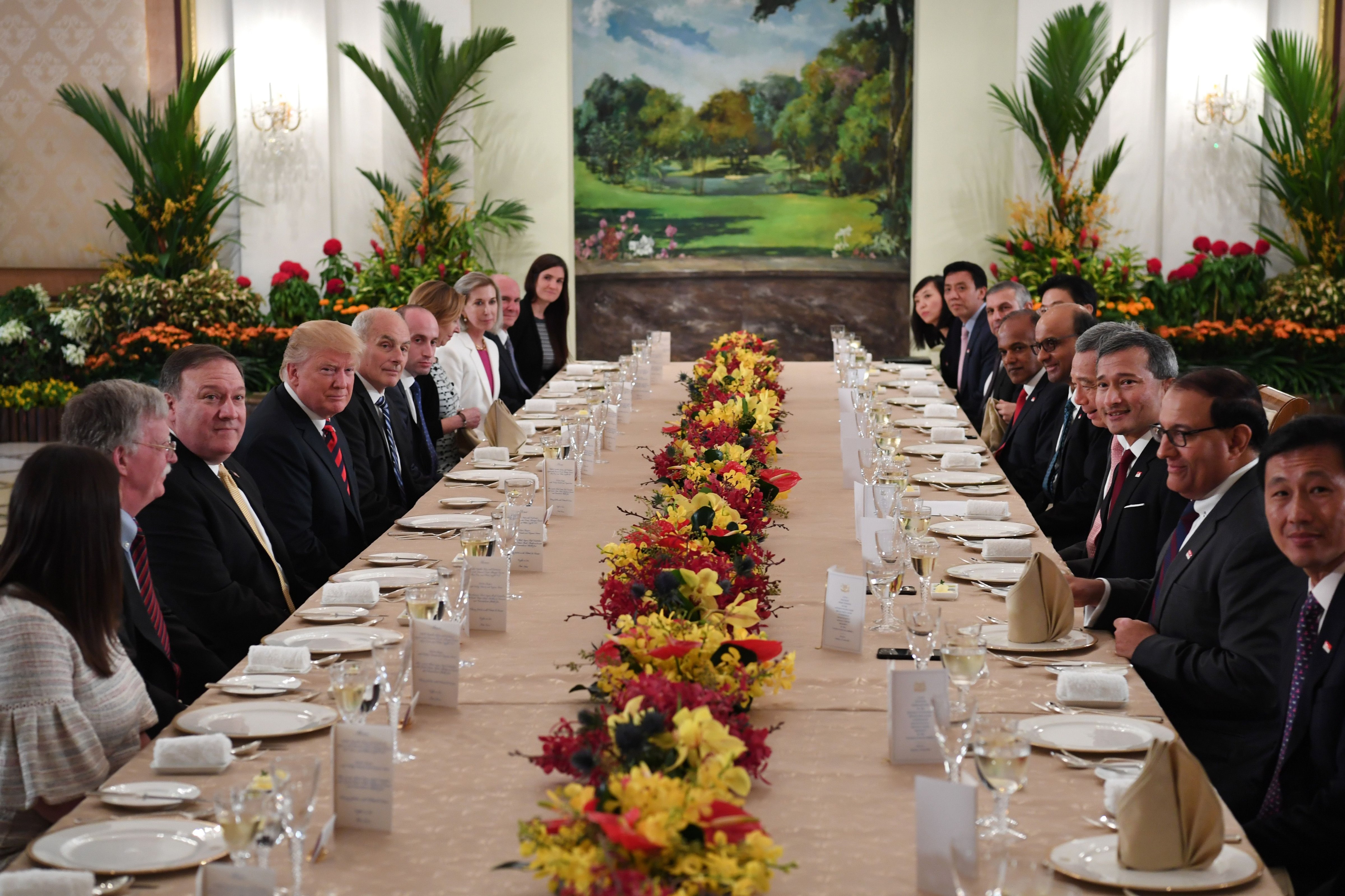 President Donald Trump and his delegation share a working lunch Singapore's Prime Minister Lee Hsien Loong (4th R) and his team during the U.S. leader's visit to Singapore on June 11, 2018. (Saul Loeb—AFP/Getty Images)