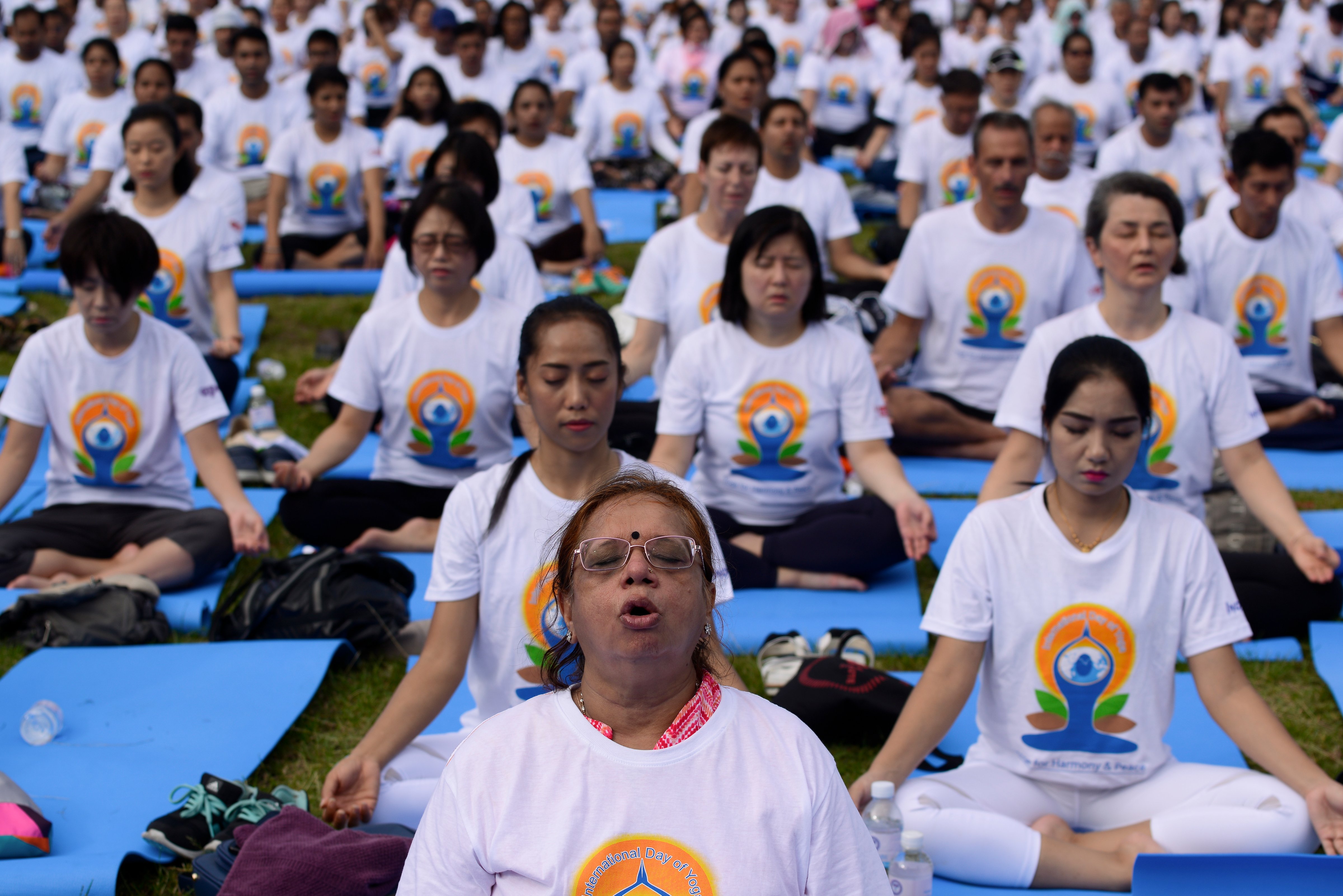 In the run up to the International Day of Yoga on June 21, thousands of people participate in a yoga exercise at Chulalongkorn University field in Bangkok, Thailand on June 17, 2018. (Anusak Laowilas/NurPhoto via Getty Images)