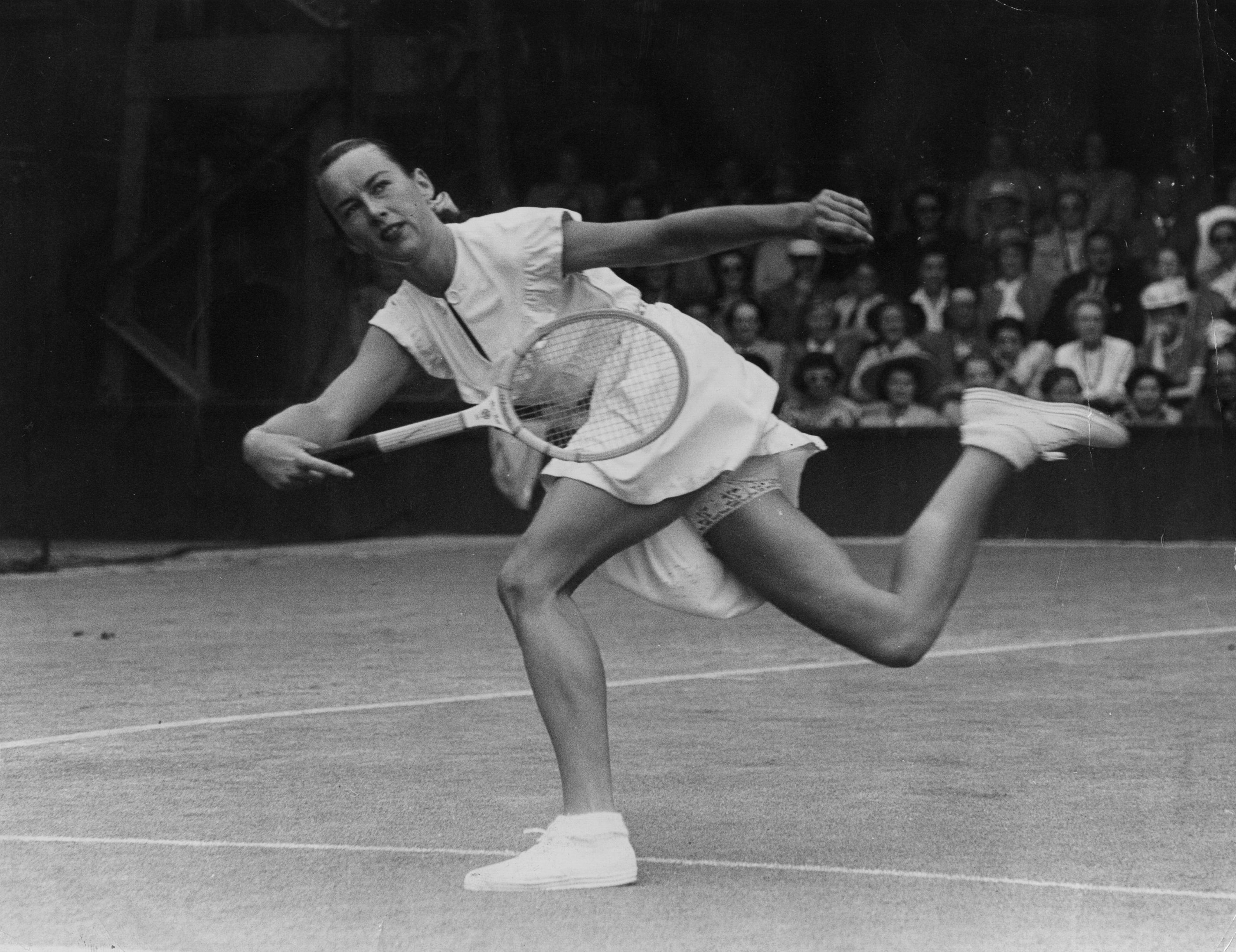American tennis player Gertrude Moran, or Gorgeous Gussie, in action on her way to beating F M Wilford at Wimbledon on June 22, 1949. (George W. Hales—Getty Images)