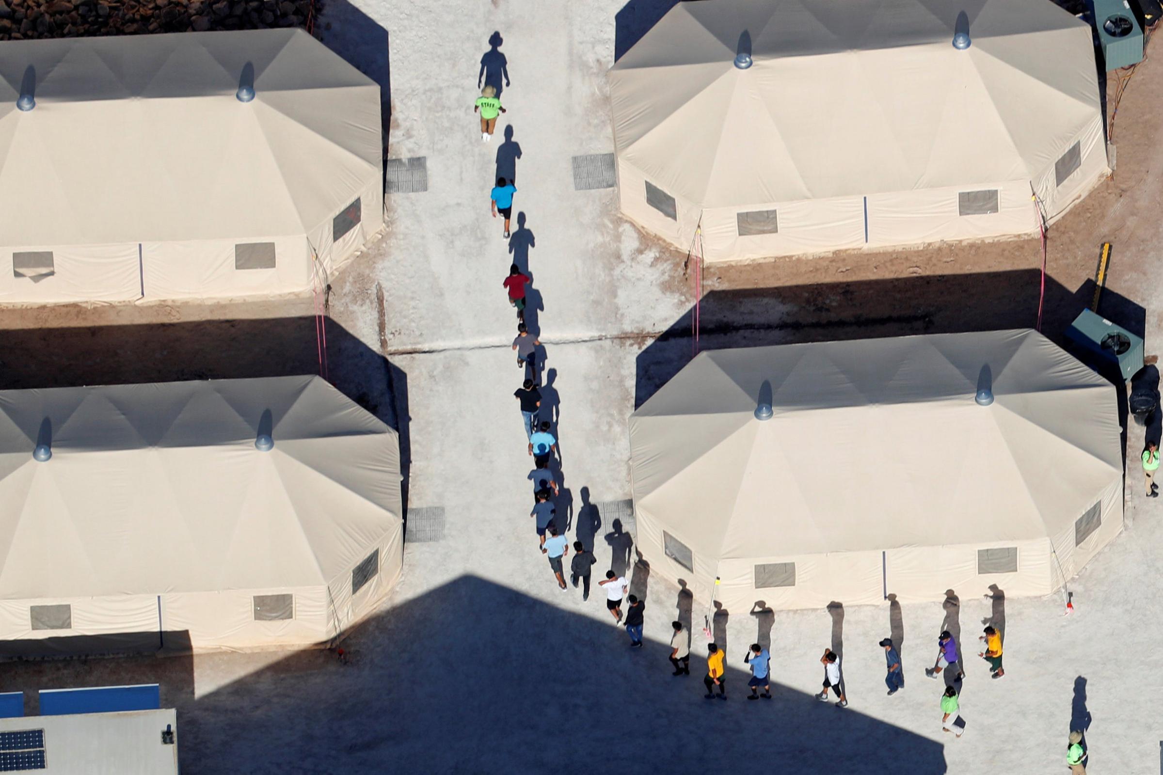Immigrant children walk in single file