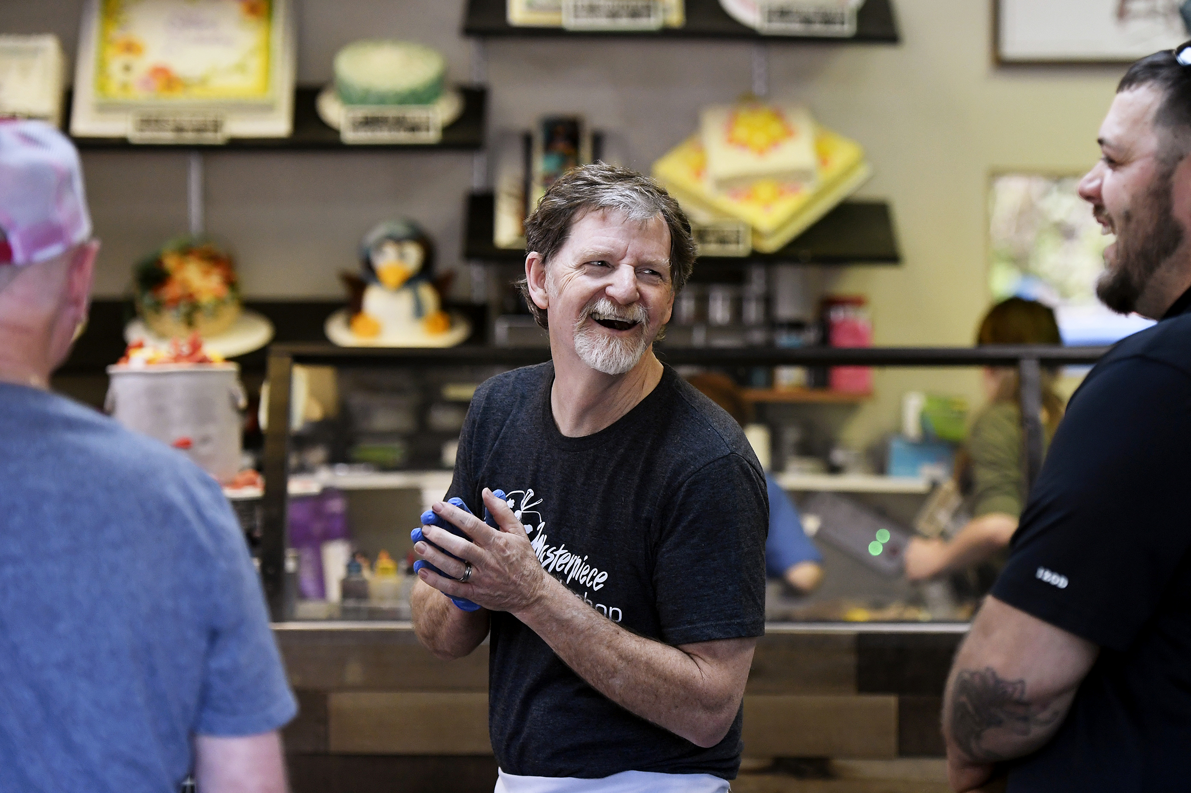 Phillips, at his bakery, smiling after the decision (Joe Amon—Denver Post/Getty Images)
