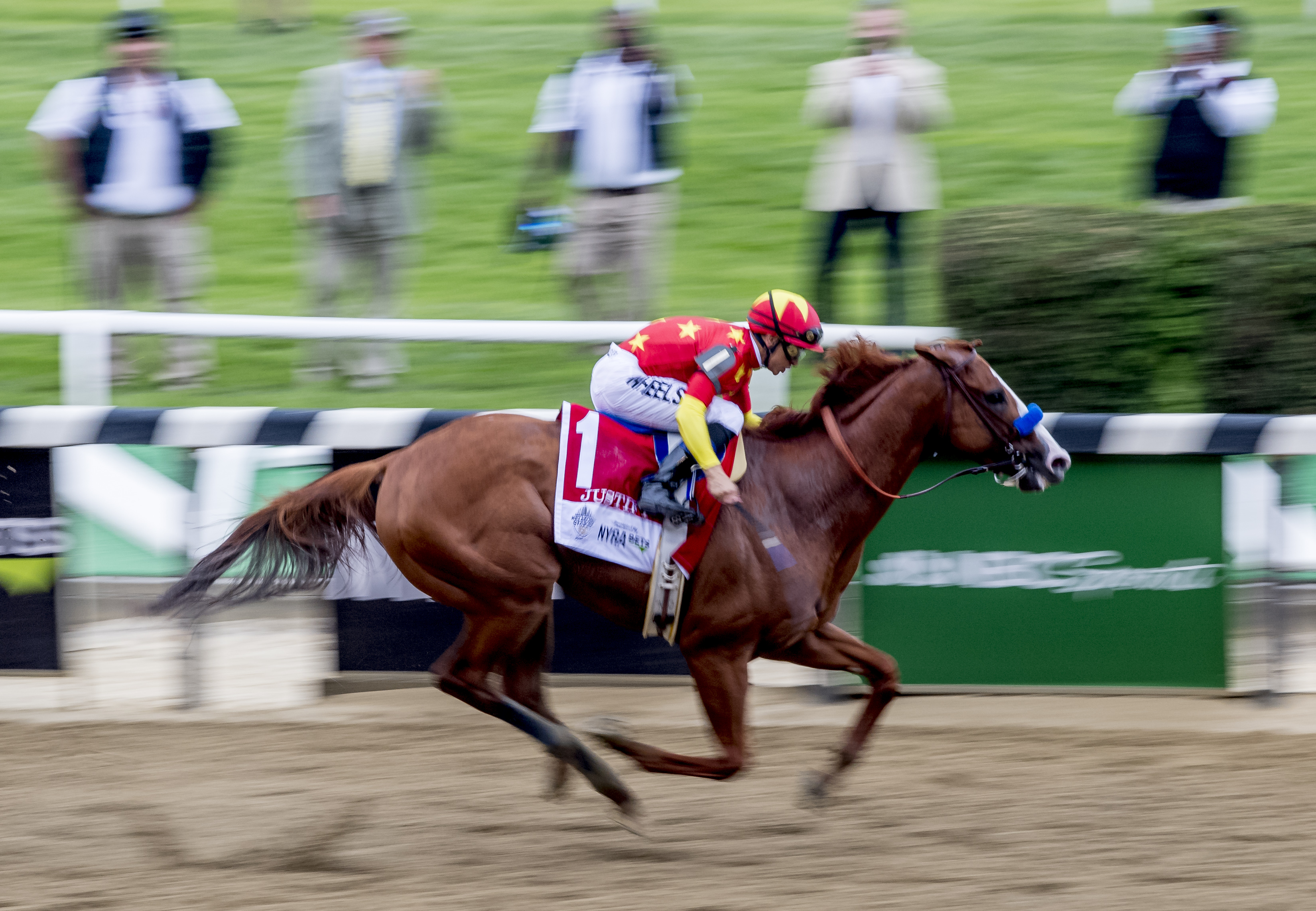 Justify #1, ridden by Mike Smith, wins the Belmont Stakes on Belmont Stakes Day at Belmont Park on June 9, 2018 in Elmont, New York (Eclipse Sportswire—Getty Images)