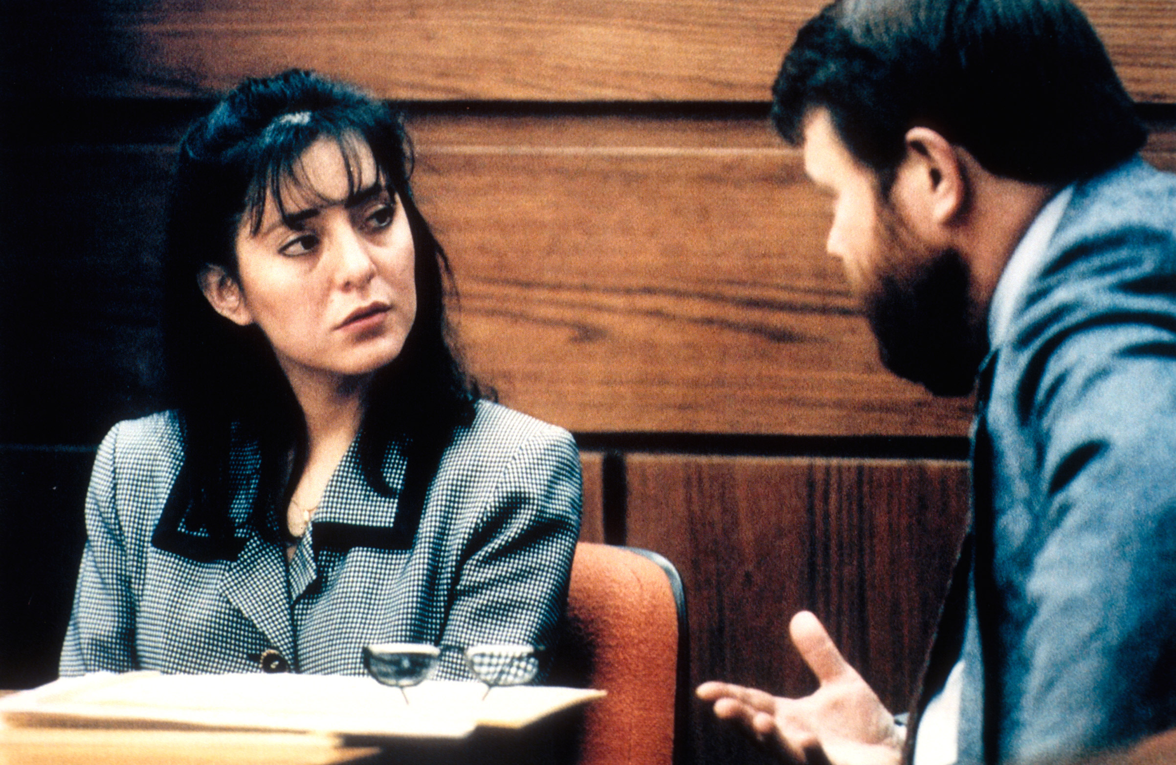 Lorena Bobbitt is questioned by an attorney during her trial 	on Jan. 10, 1994, where she is charged with 'malicious wounding' after cutting off her husband's penis following an alleged rape. (Jeffrey Markowitz/Sygma—Getty Images)