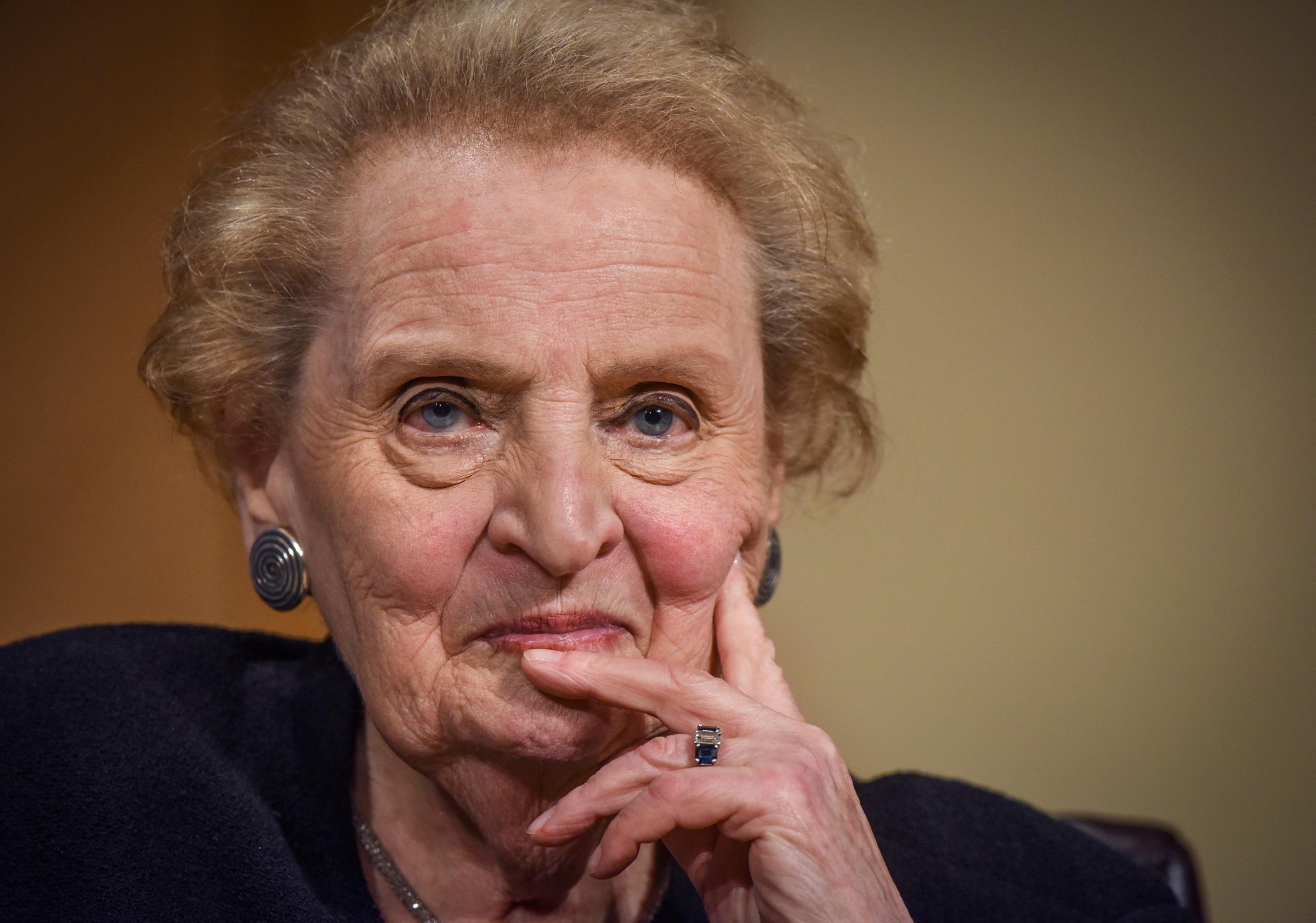 Former Secretary of State Madeleine Albright with her hand on her head