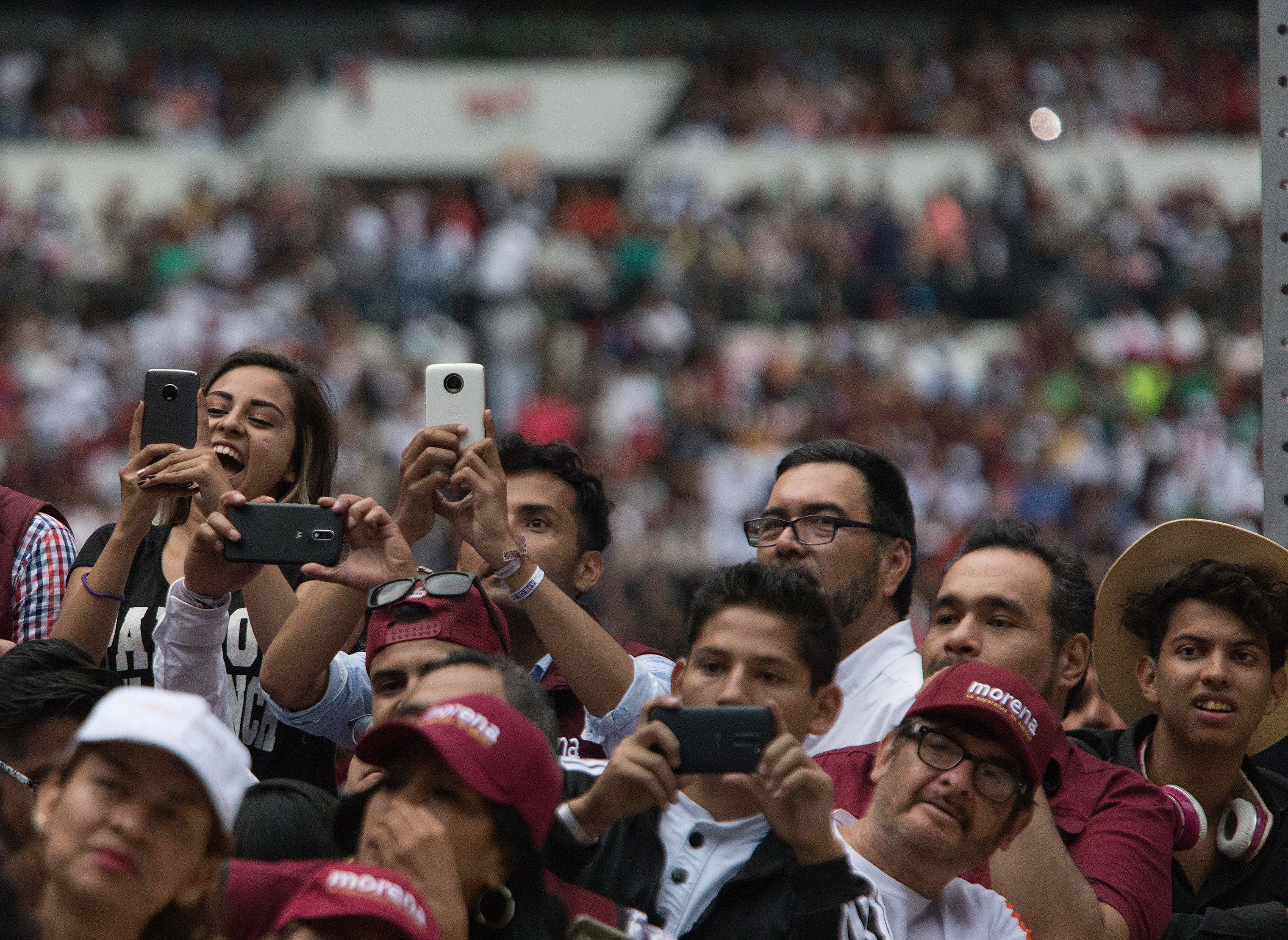 Supporters hold up their mobile phones during a musical performance at López Obrador's final campaign rally at Estadio Azetca in Mexico City on June 27. (Christopher Morris—VII for TIME)