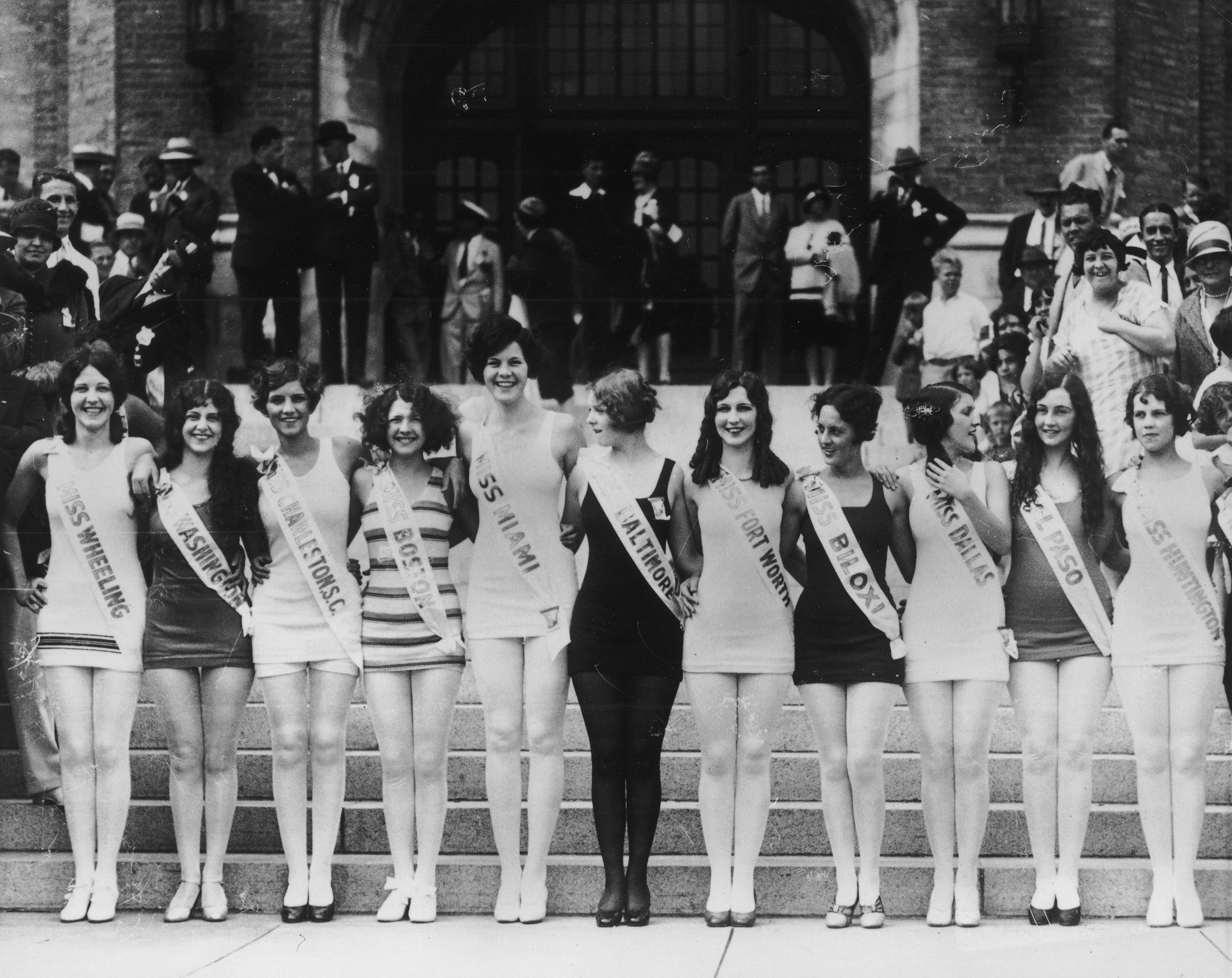 1927: Contestants in the 'Miss America' pageant pose in a line, with their arms around each other, Atlantic City, N.J. (American Stock Archive/Getty Images)
