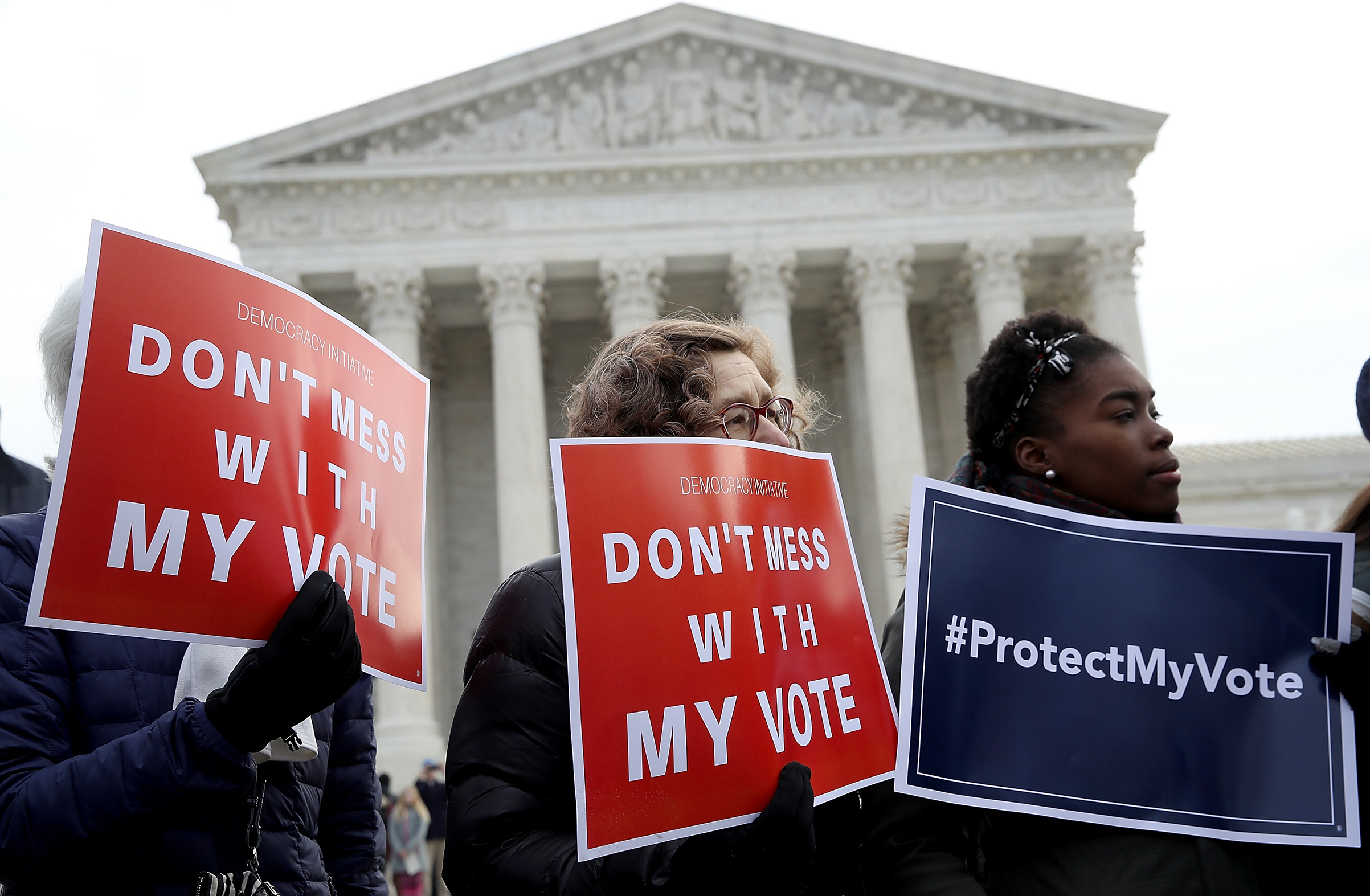 Protesters gather during a rally held by the group Common Cause in front of the U.S. Supreme Court January 10, 2018 in Washington, DC. Voting rights activists rallied to oppose voter roll purges as the Supreme Court hears oral arguments in the Husted v. A Philip Randolph Institute, a challenge to Ohio's voter roll purges. (Win McNamee—Getty Images)