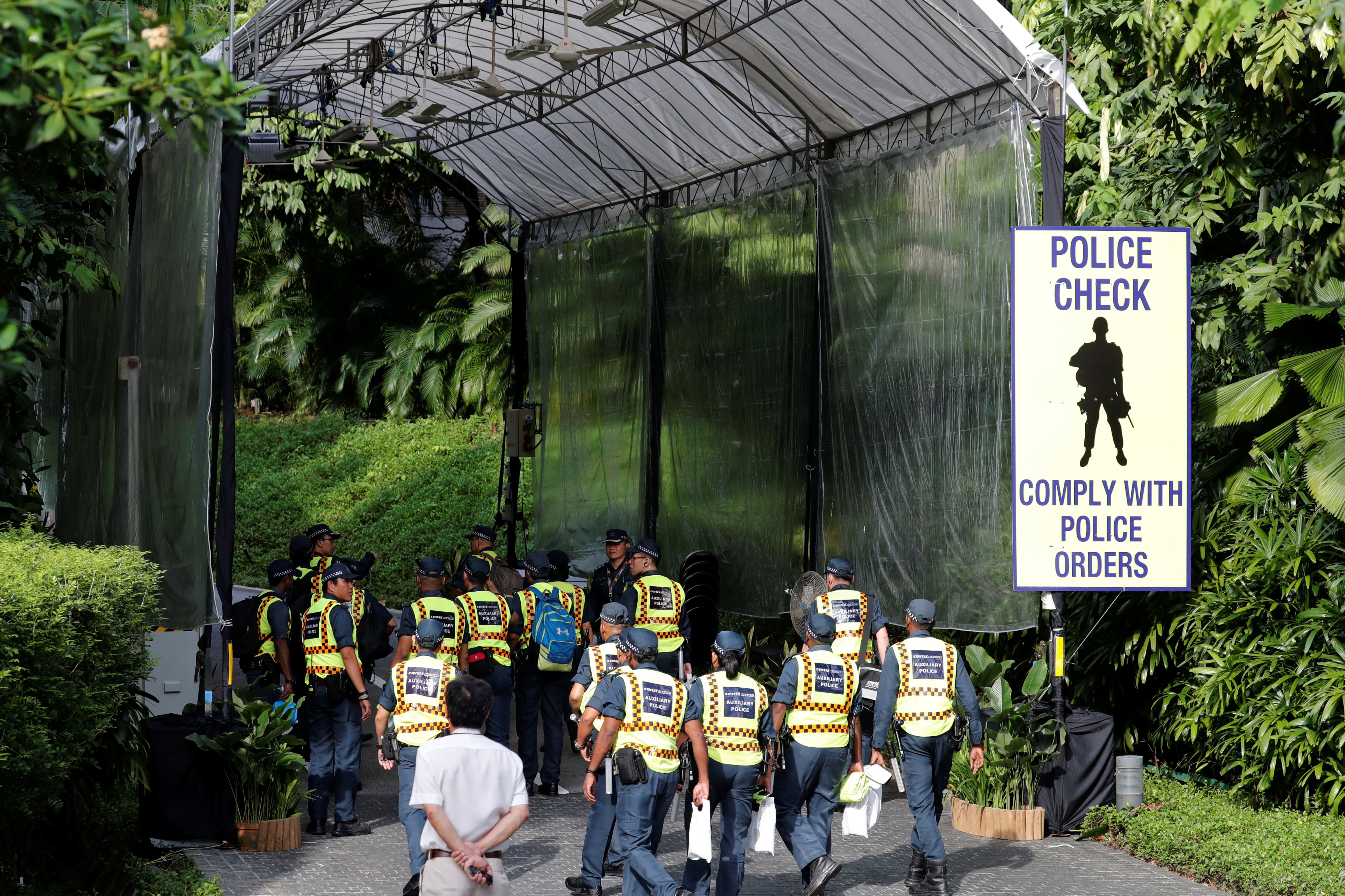 Auxiliary police report for duty at Capella Hotel on Sentosa Island in Singapore June 11, 2018. (Kim Kyung Hoon—Reuters)