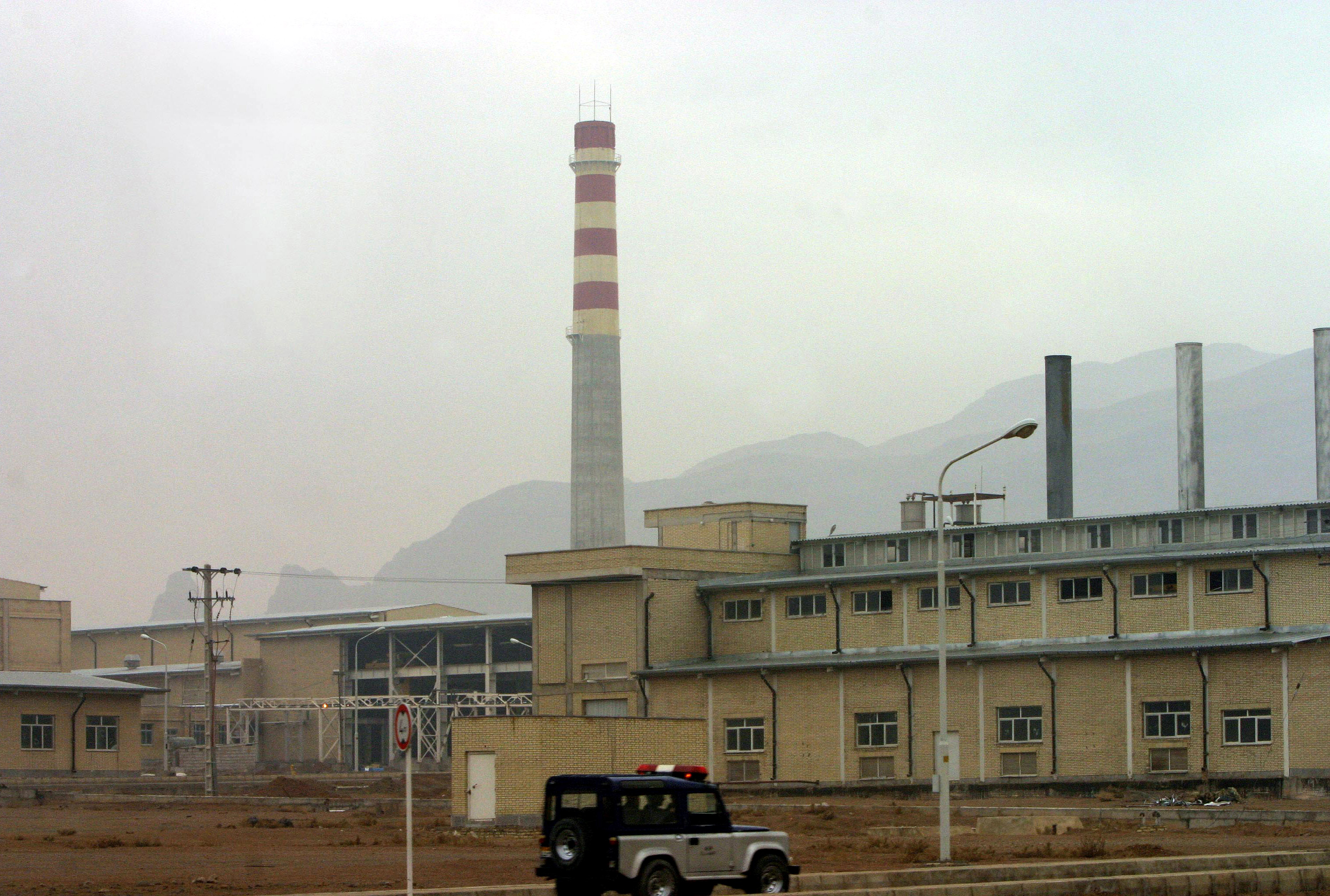 A security car passes in front of the Natanz nuclear facility, 300 km south of Tehrah, Iran on Nov. 20, 2004. (Stringer/Reuters)
