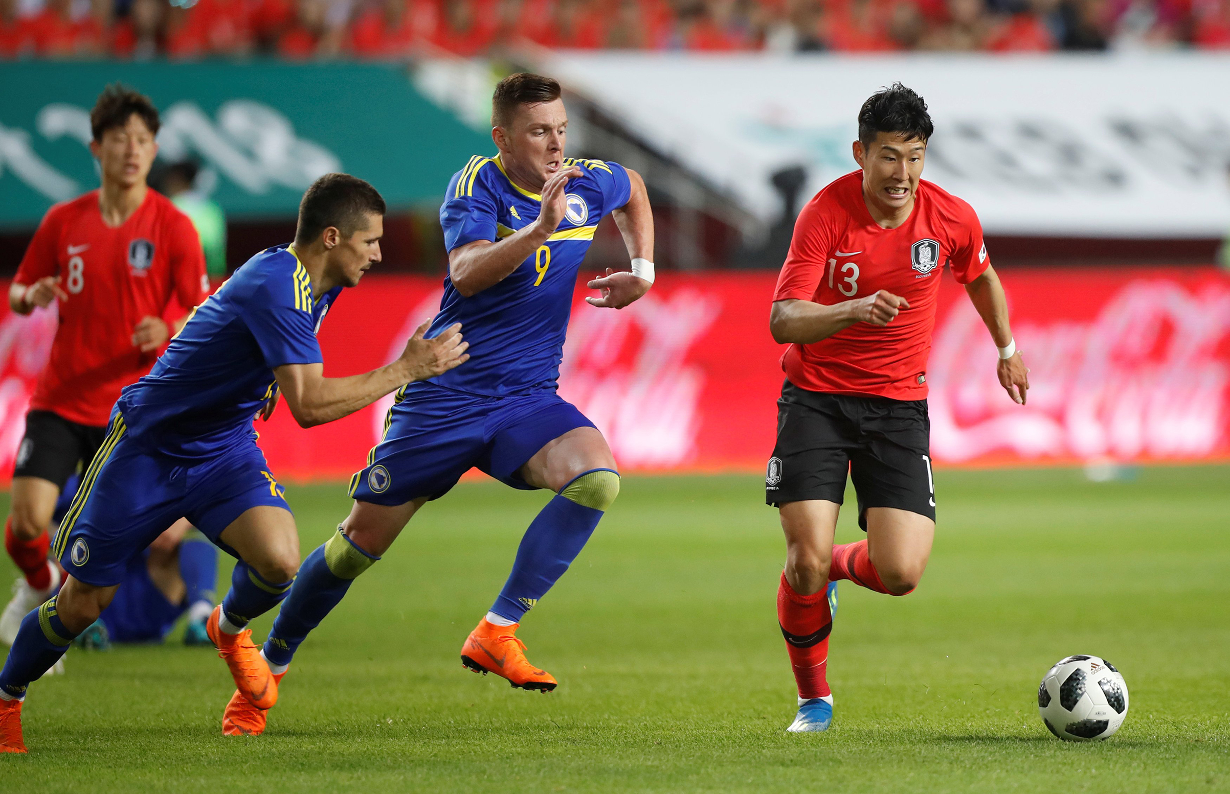 South Korea's Son Heung-Min in action with Bosnia's Haris Duljevic on June 1. (Kim Hong-Ji—Reuters)