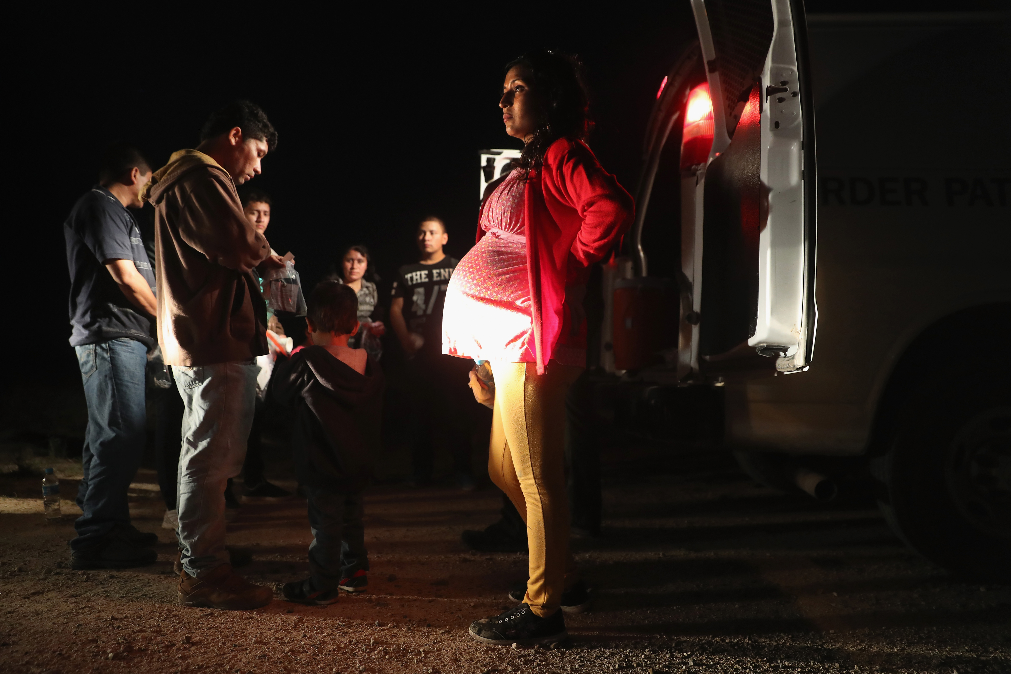 Immigrants from Central America wait to be taken into custody by U.S. Border Patrol agents in Roma, Texas on August 17, 2016. (John Moore—Getty Images)