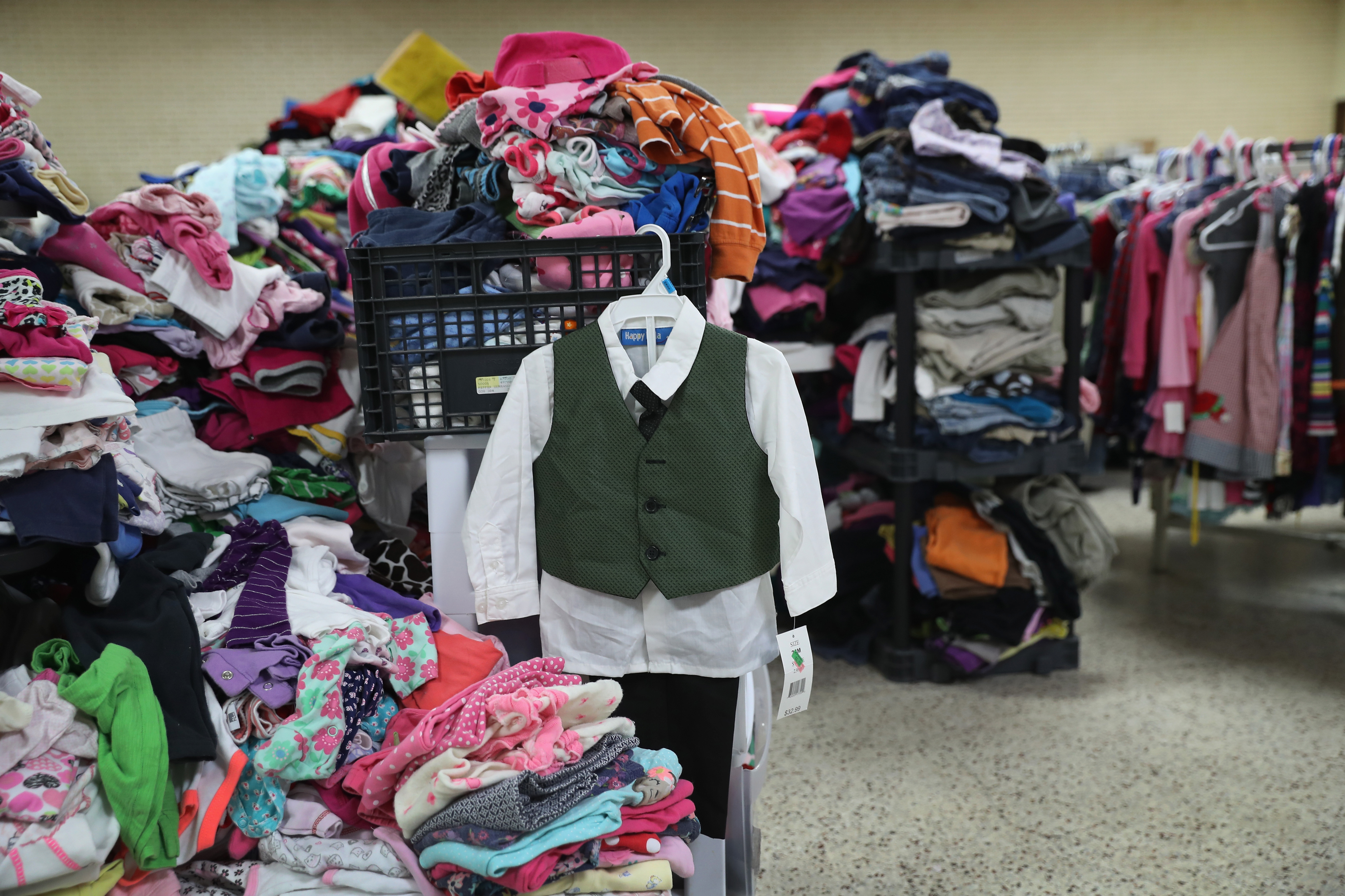 Donated clothing await immigrants at the Catholic Sacred Heart Church Immigrant Respite Center from McAllen, Texas on Aug. 15, 2016. (John Moore—Getty Images)