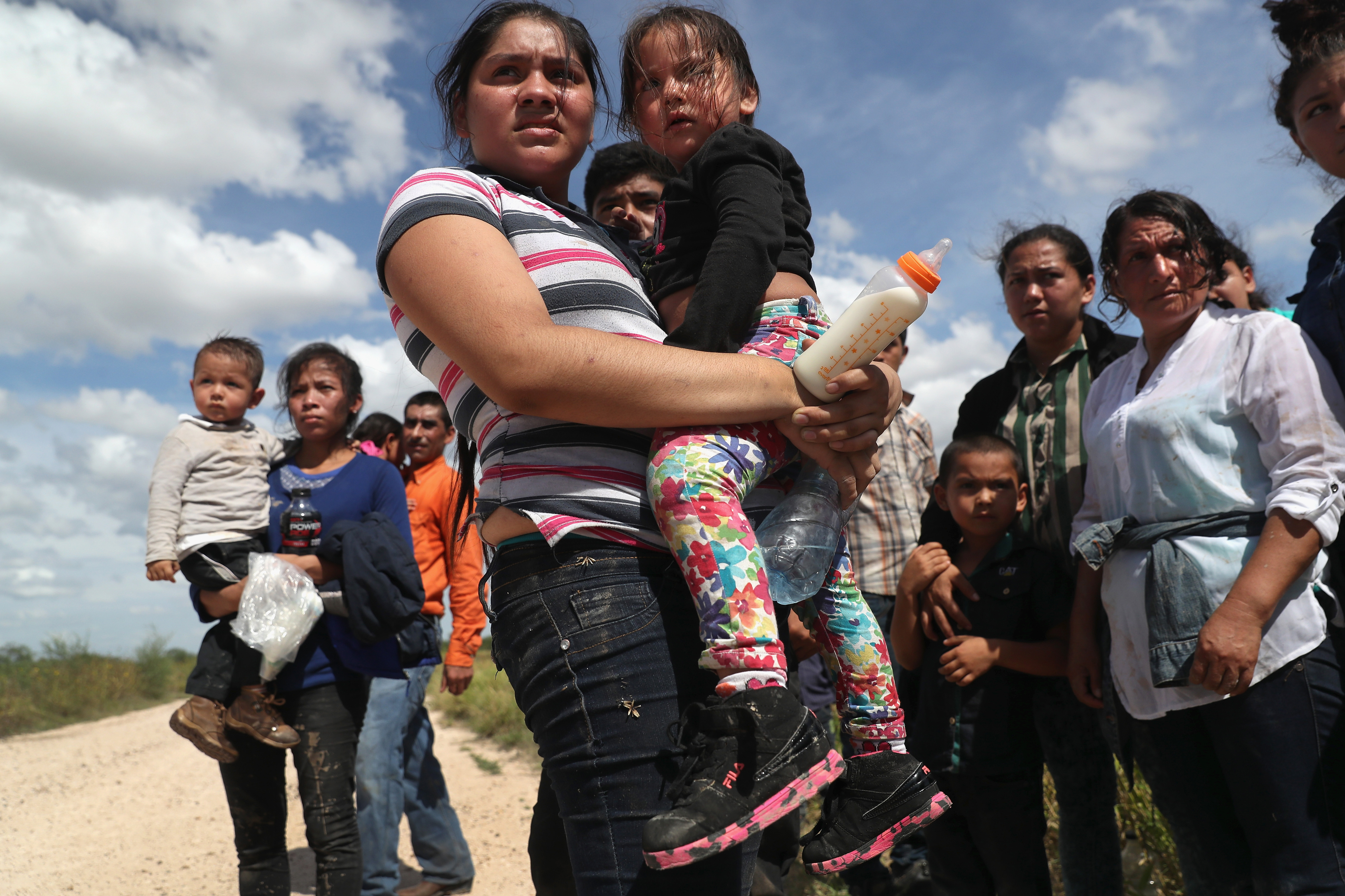Immigrants from Central America await transport from the U.S. Border Patrol in Roma, Texas on Aug. 17, 2016. (John Moore—Getty Images)