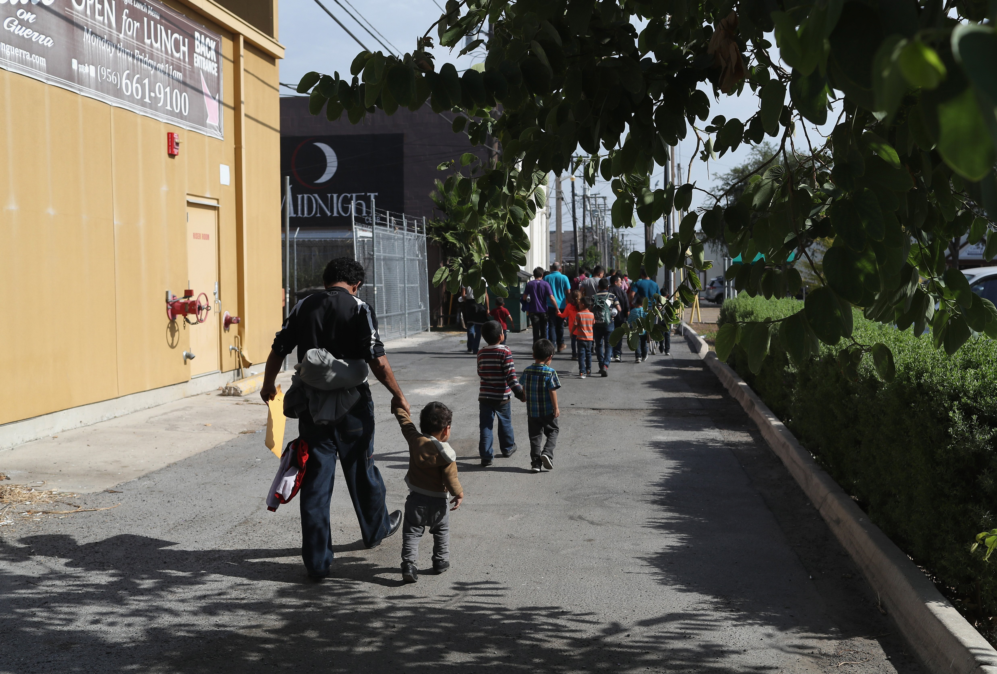Central American immigrant families depart ICE custody, pending future immigration court hearings in McAllen, Texas on June 11, 2018. (John Moore—Getty Images)