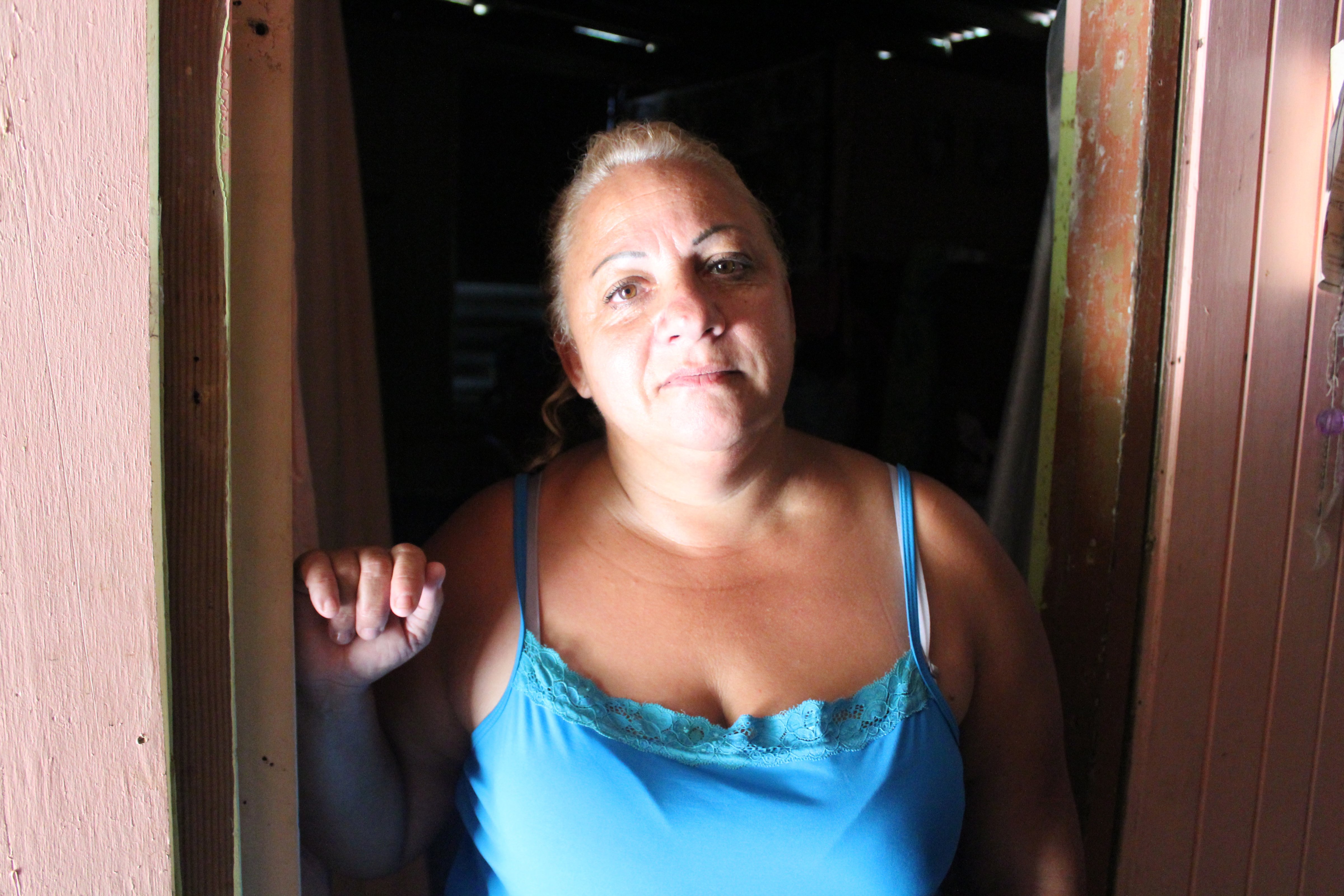Elba Negron Carreras lives on top of a hill in rural Utuado, Puerto Rico. She and her two children lived with no water service for nearly eight months. (Carmen Heredia Rodriguez/KHN)