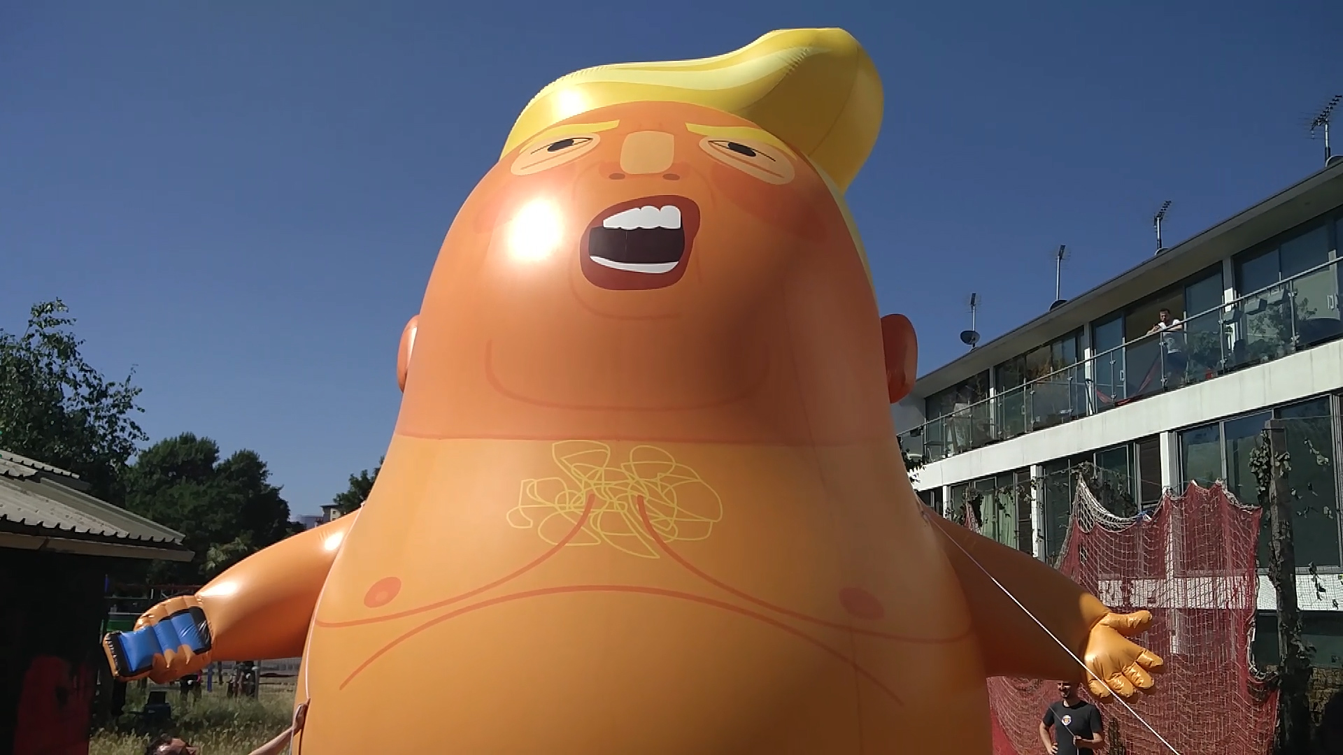 A six-meter high balloon depicting a baby Donald Trump in a diaper was unveiled June 26 in London, ahead of the U.S. President's July 13 visit to the U.K. (Billy Perrigo—TIME)