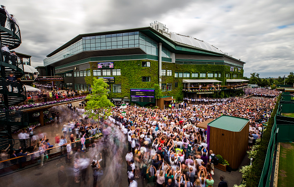 Crowds gather outside centre court on day thirteen of the Wimbledon Championships at the All England Lawn Tennis and Croquet Club, Wimbledon. (Steven Paston/PA Images via Getty Images)
