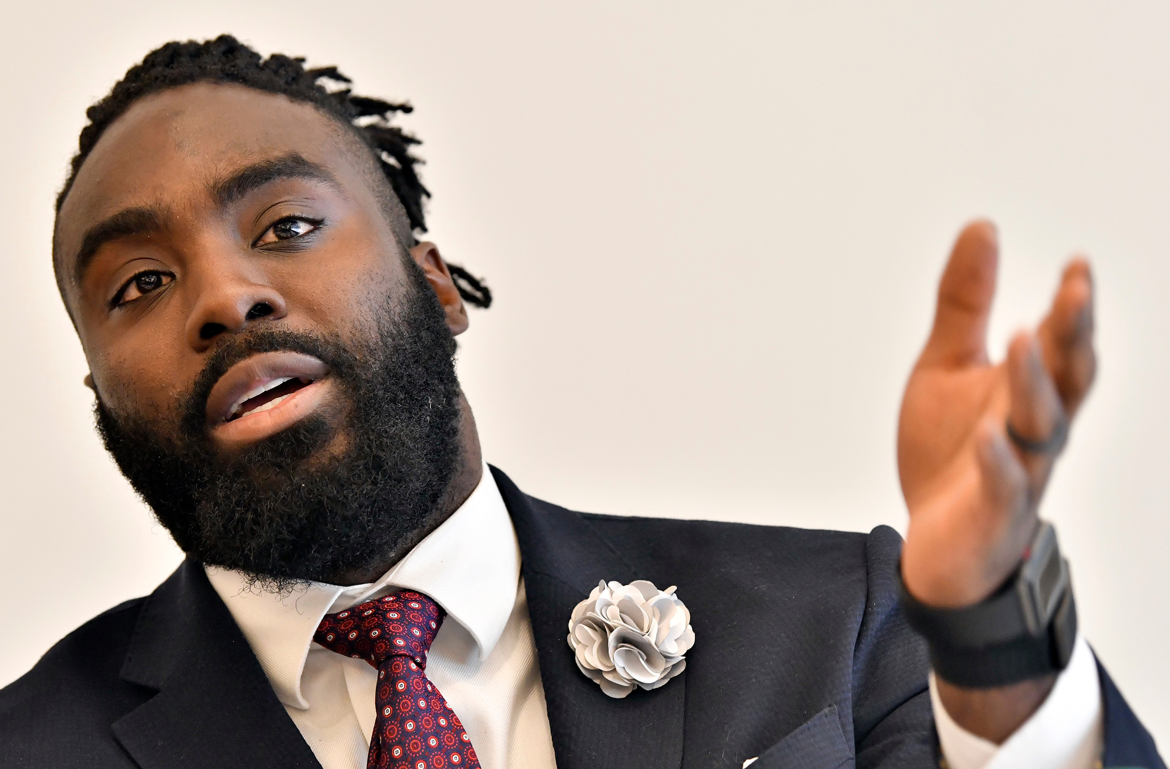 New Orleans Saints' Demario Davis discusses criminal justice issues with other current and former NFL football players at Harvard Law School, in Cambridge, Mass. on March 23, 2018. (Josh Reynolds—AP/Shutterstock)