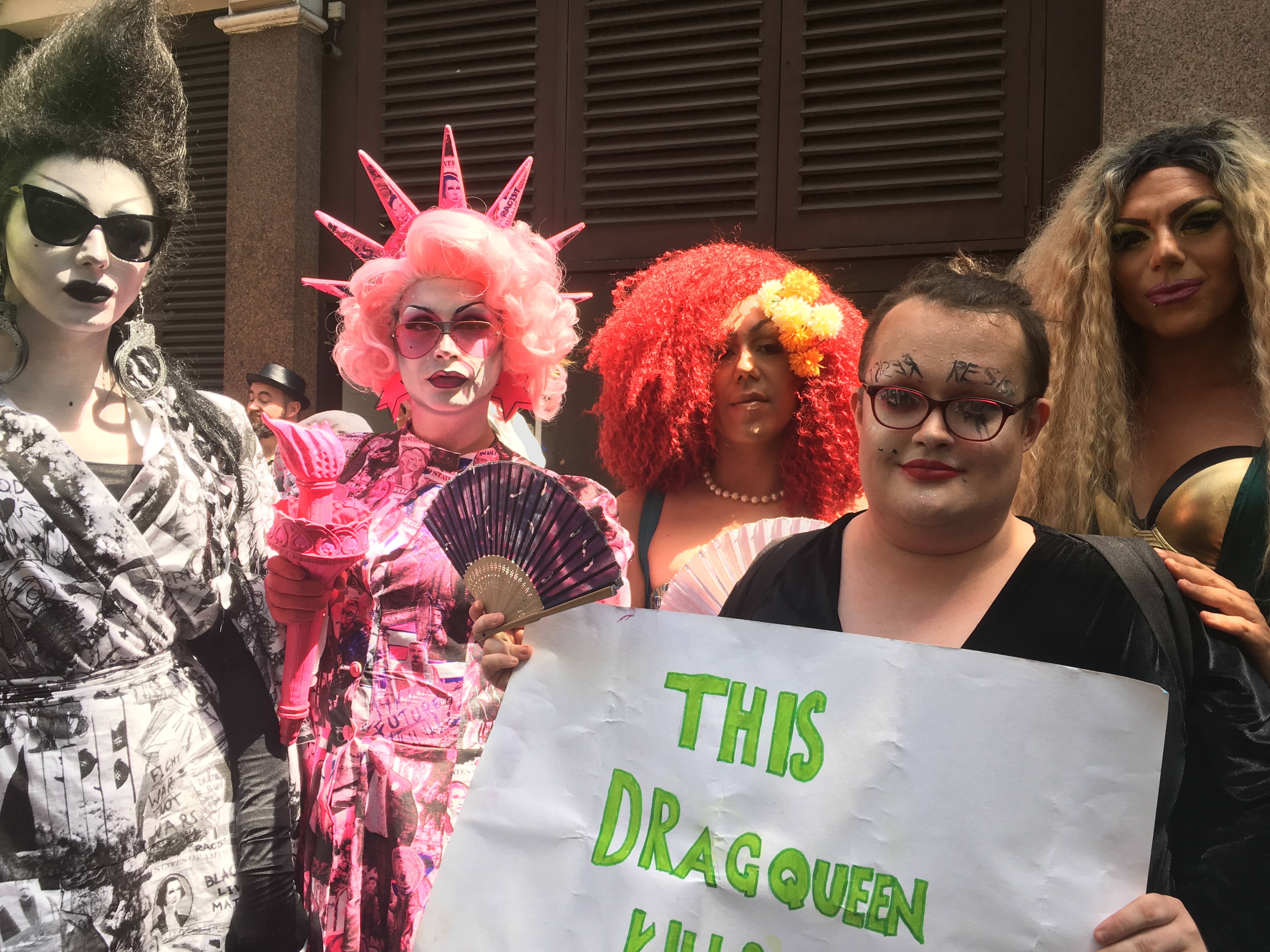 Drag queens, including Liquorice Black (far left), Maryanne Misandry (front centre) and Very Berry (far right), gather to protest Trump's visit in Soho, central London on July 13. (TIME)