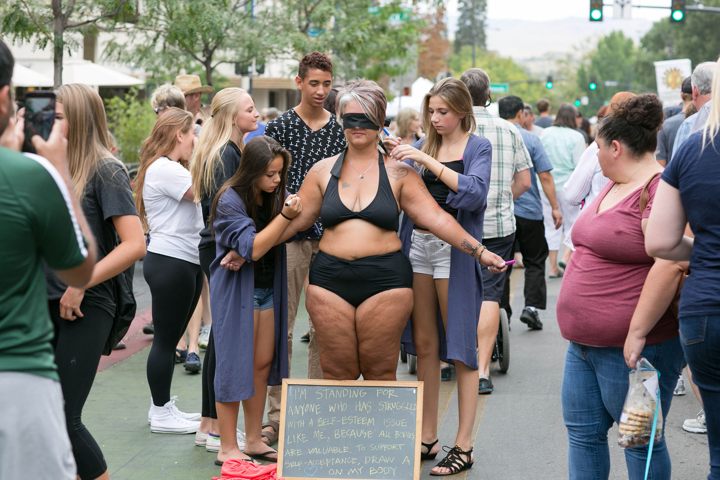 Body image activist Amy Pence-Brown participating in her "self-love performance art piece" in Capital City Public Market in Boise, Idaho on Aug. 29, 2015. (Melanie Folwell)