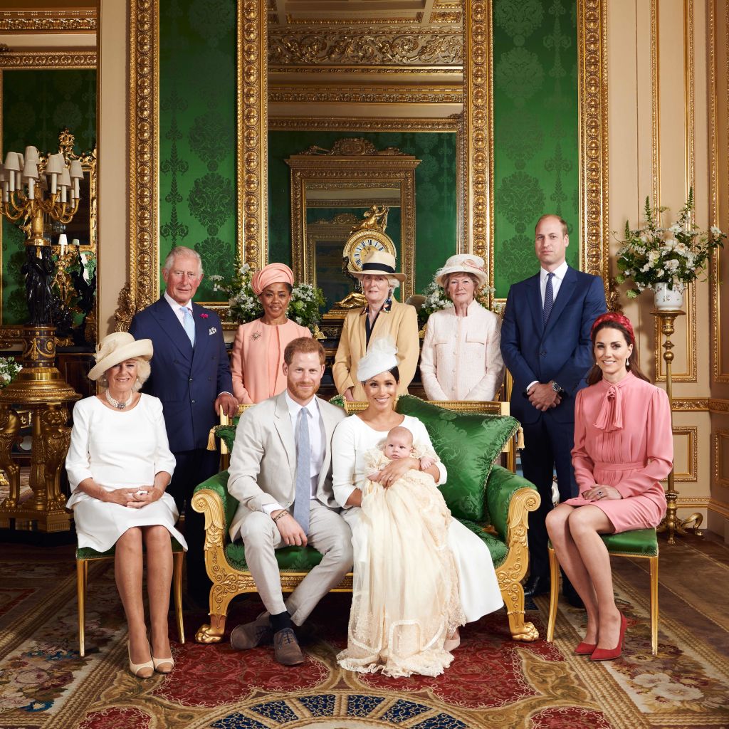 This official handout Christening photograph released by the Duke and Duchess of Sussex shows Britain's Prince Harry, Duke of Sussex (centre left), and his wife Meghan, Duchess of Sussex holding their baby son, Archie Harrison Mountbatten-Windsor flanked by (L-R) Britain's Camilla, Duchess of Cornwall, Britain's Prince Charles, Prince of Wales, Ms Doria Ragland, Lady Jane Fellowes, Lady Sarah McCorquodale, Britain's Prince William, Duke of Cambridge, and Britain's Catherine, Duchess of Cambridge in the Green Drawing Room at Windsor Castle, west of London on July 6, 2019. (Chris Allerton—AFP/Getty Images)