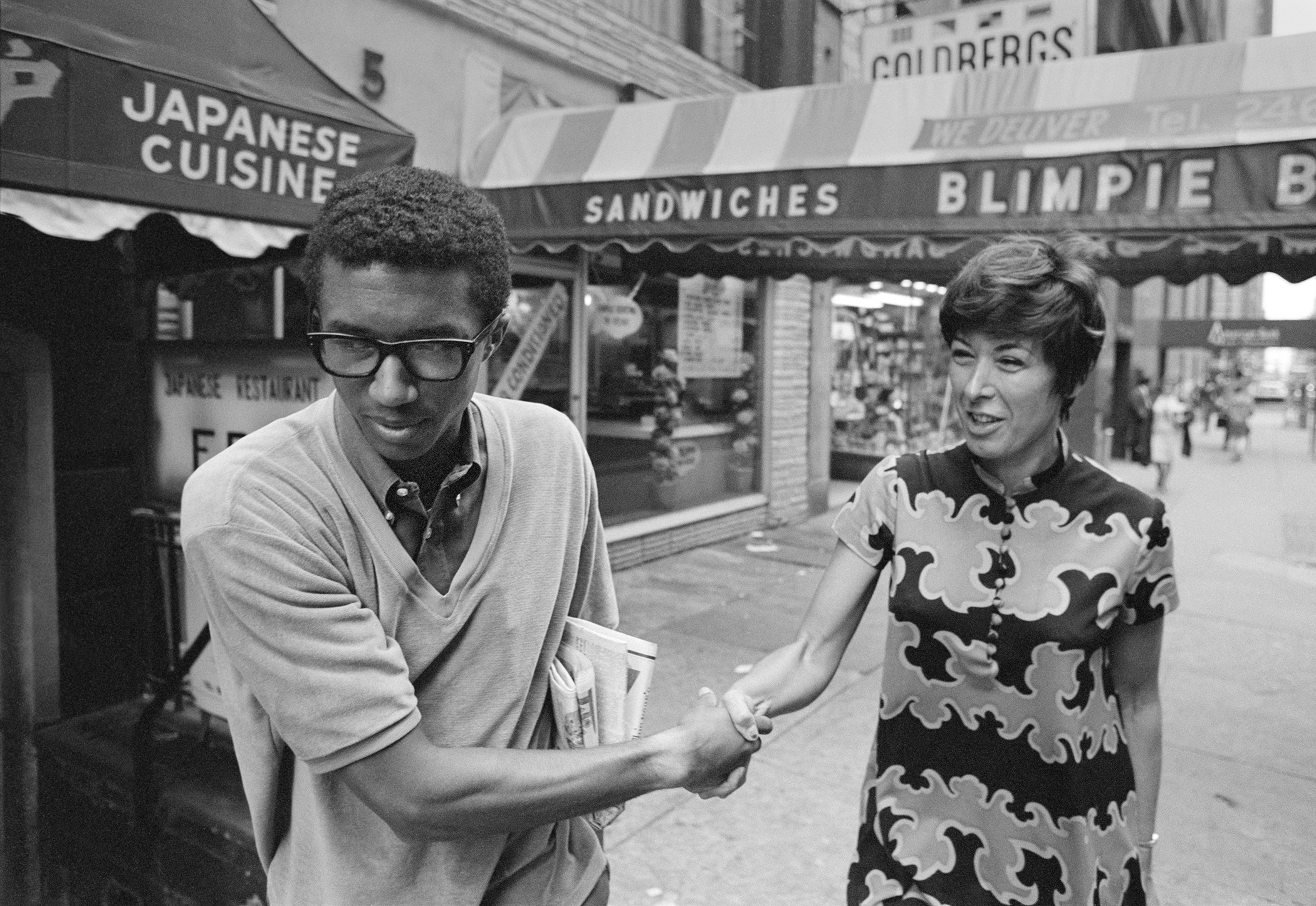 Arthur Ashe shakes hands with a fan in New York City, September 10, 1968, the day after winning the U.S. Open Men's Singles Championship. Photograph by John G. Zimmerman.
