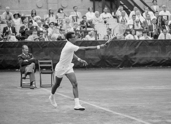 Arthur Ashe hits a running forehand during his 5 set victory over Tom Okker in the 1968 US Open Men's Singles Championship. September 9, 1968. Photo by John G. Zimmerman.