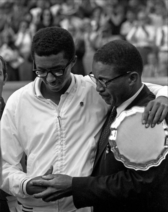American tennis player Arthur Ashe (1943 - 1993) with his father after winning the first ever US Open at the West Side Tennis Club, Forest Hills, New York, September 9, 1968. Photographer John G. Zimmerman