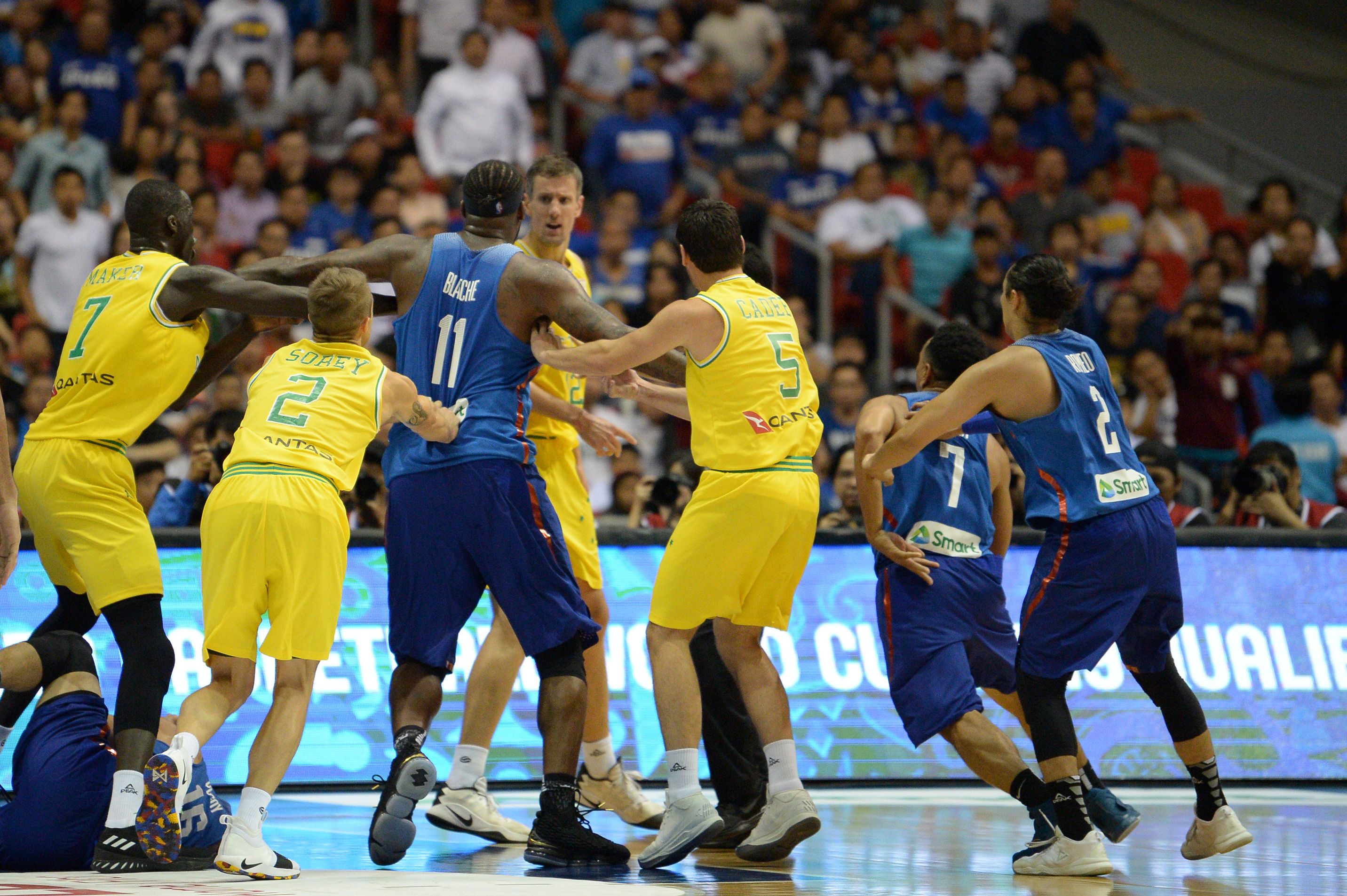 Philippine (blue) and Australian (yellow) players engage in a brawl during their FIBA World Cup Asian qualifier game at the Philippine arena in Bocaue town, Bulacan province, north of Manila on July 2, 2018. - Australia won by default 89-53. (TED ALJIBE&mdash;AFP/Getty Images)
